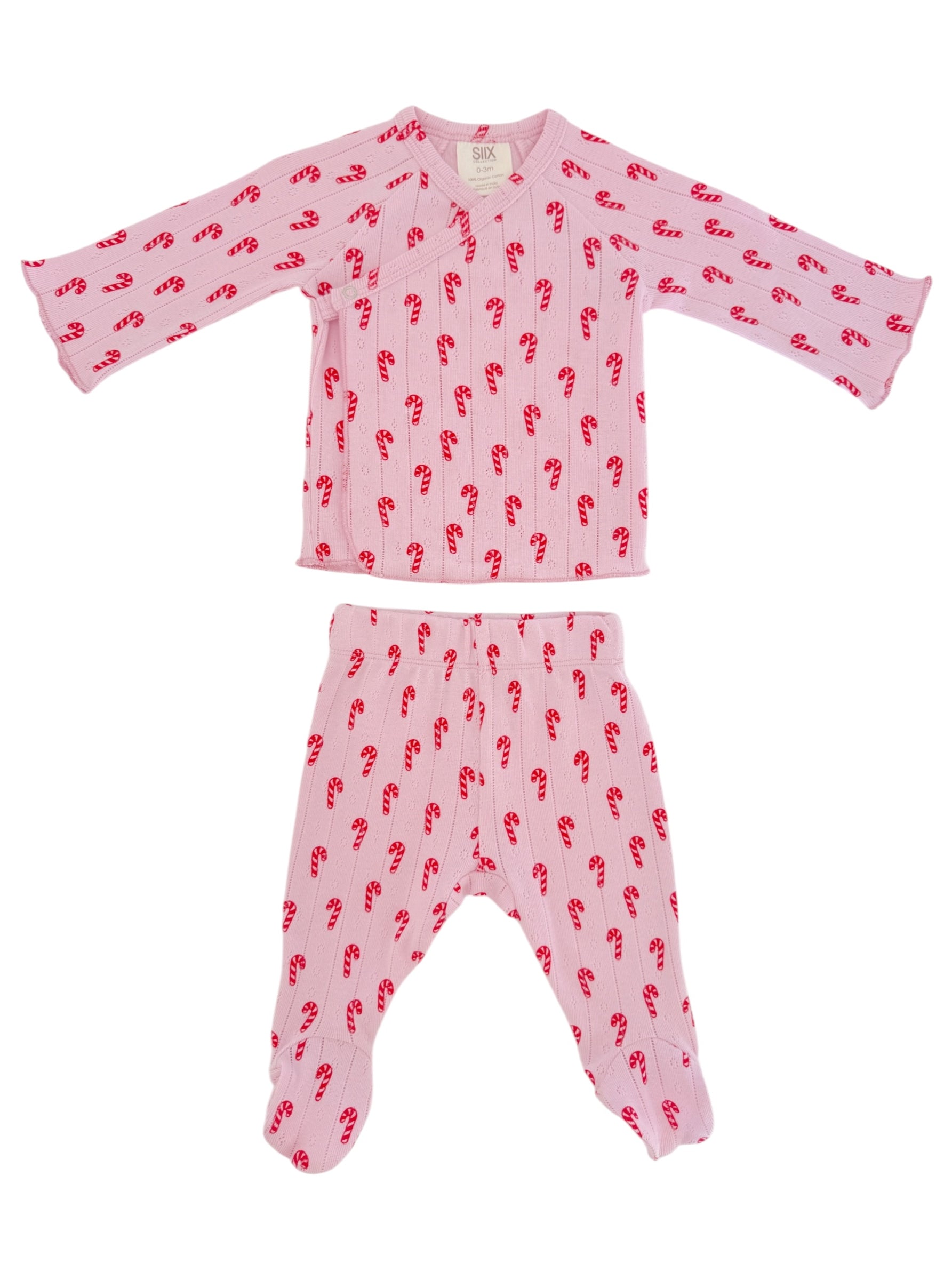 Pink pajama set with candy cane pattern; includes long-sleeved top and matching footed pants.