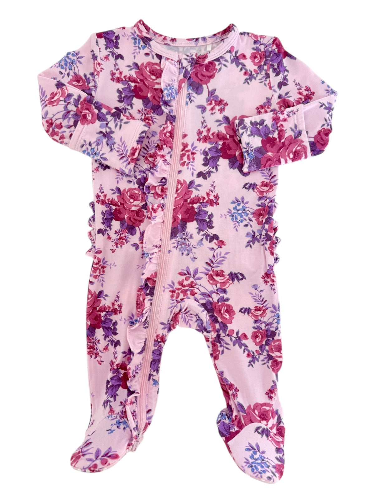 Pink floral baby onesie with ruffles and a front zipper, featuring roses and purple flower accents.