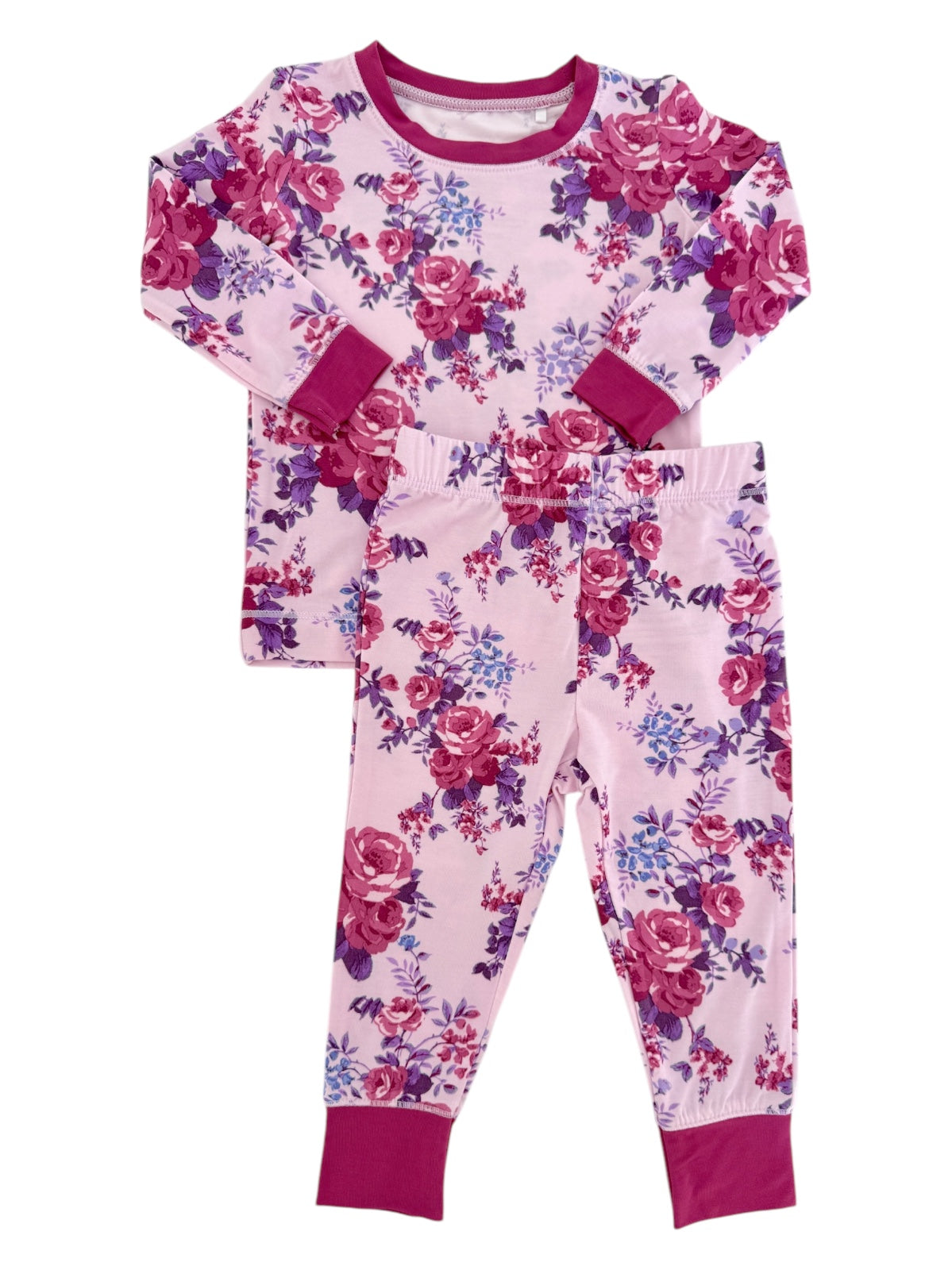 Floral children's pajama set featuring a long-sleeve top and matching pants in pink and purple hues.