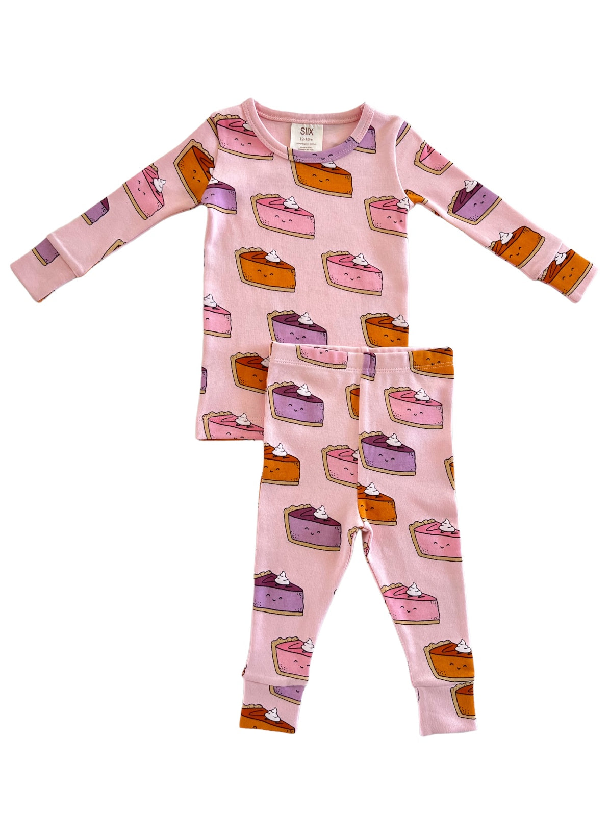 Pink pajama set featuring playful pie graphics in various colors and whipped cream toppings. Ideal for kids' sleepwear.