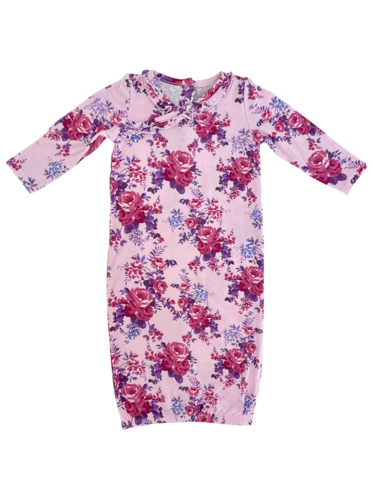 Pink floral baby dress featuring long sleeves and a round neckline with floral patterns in shades of purple and red.