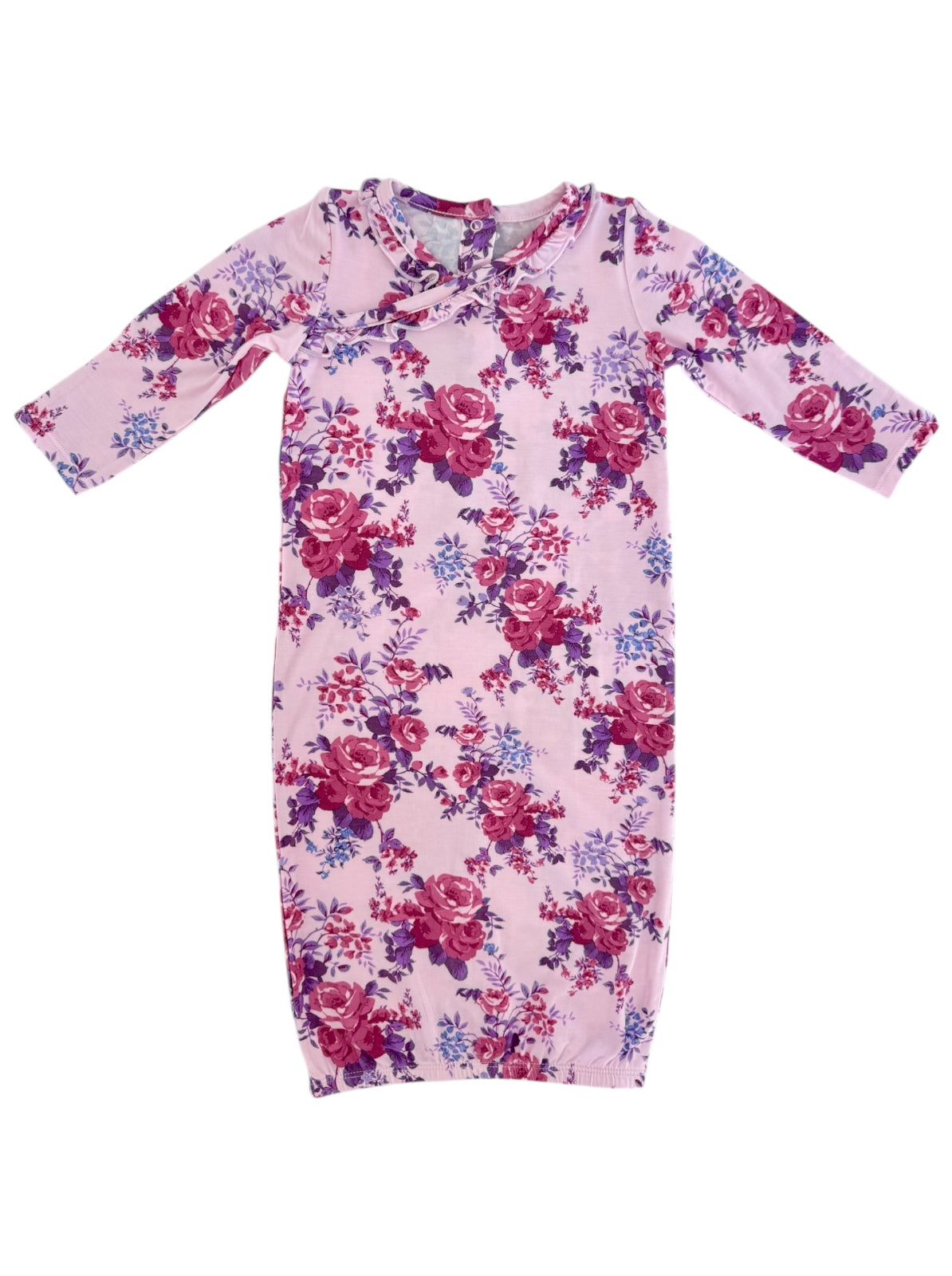 Pink floral baby dress featuring long sleeves and a round neckline with floral patterns in shades of purple and red.