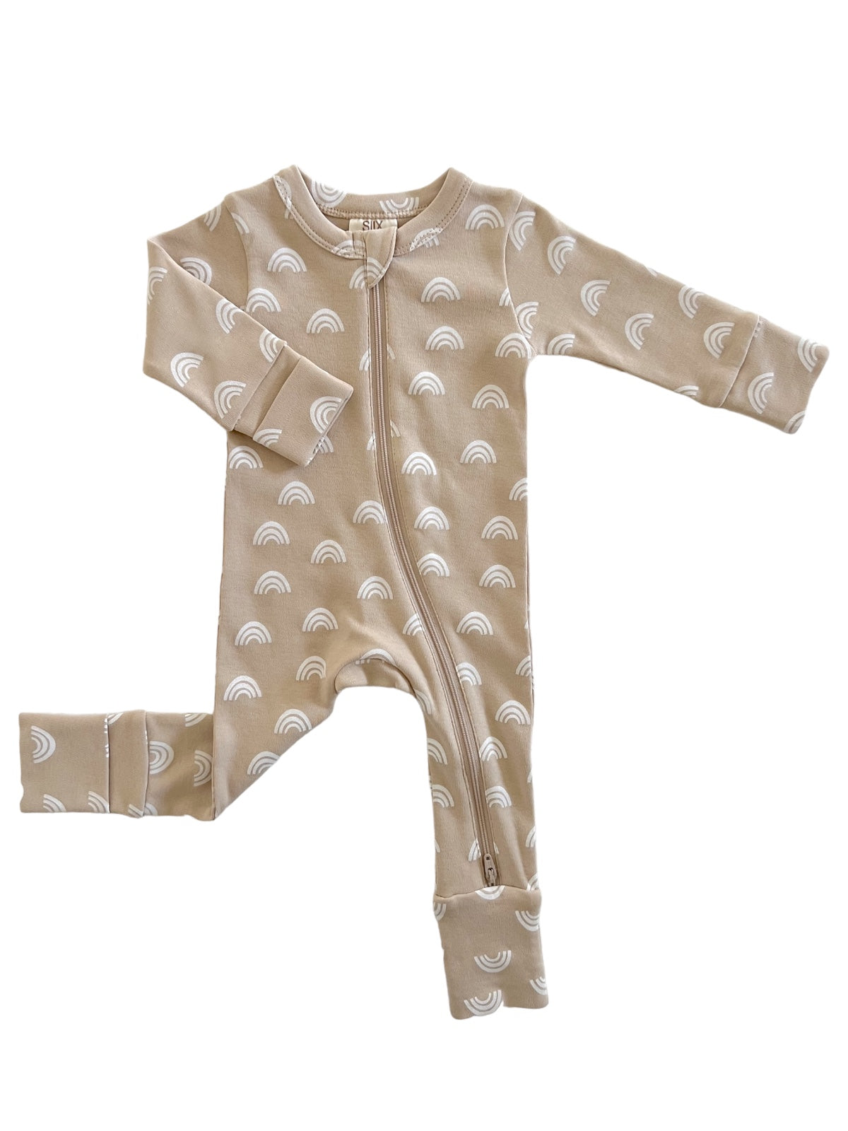 Beige baby onesie with white rainbow patterns and a front zipper. Long sleeves and footed design.