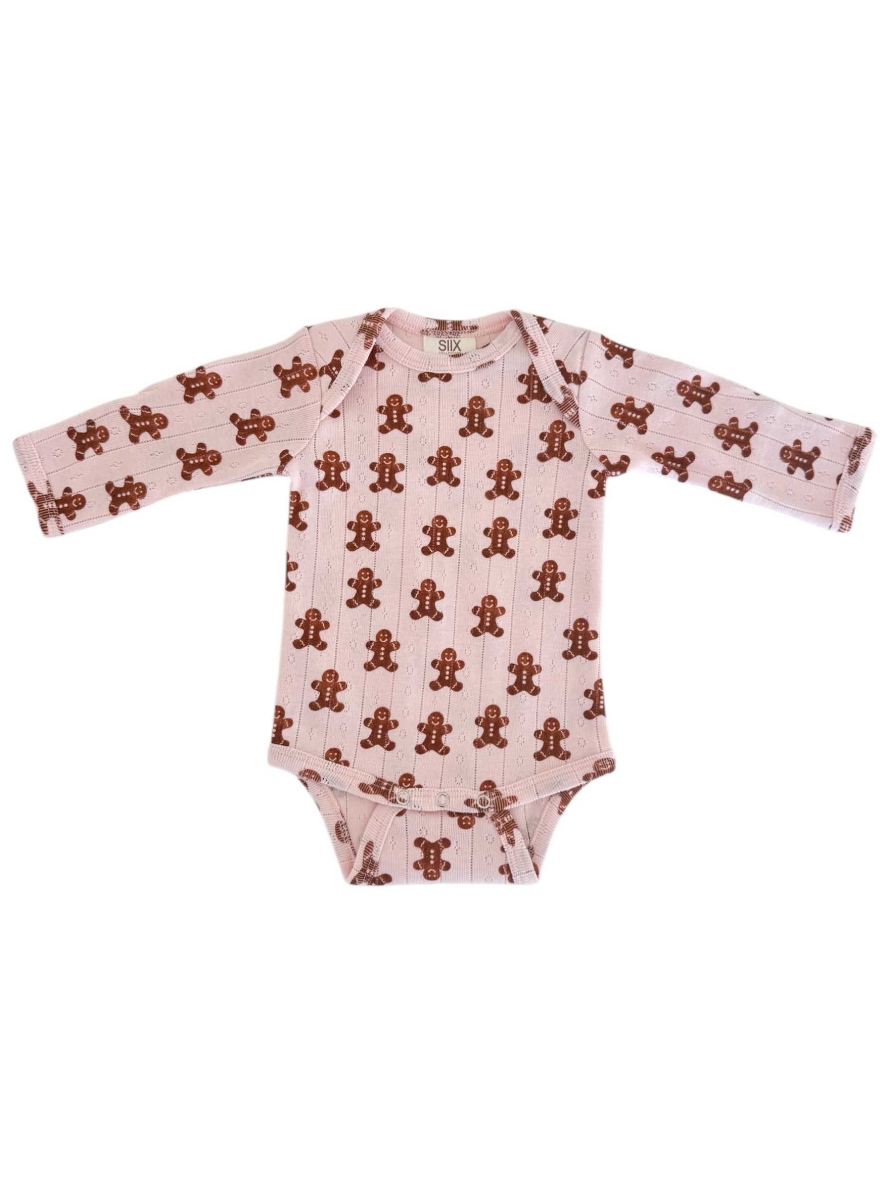 Long-sleeve baby onesie with a pink background and gingerbread man pattern. Perfect for cozy outfits.