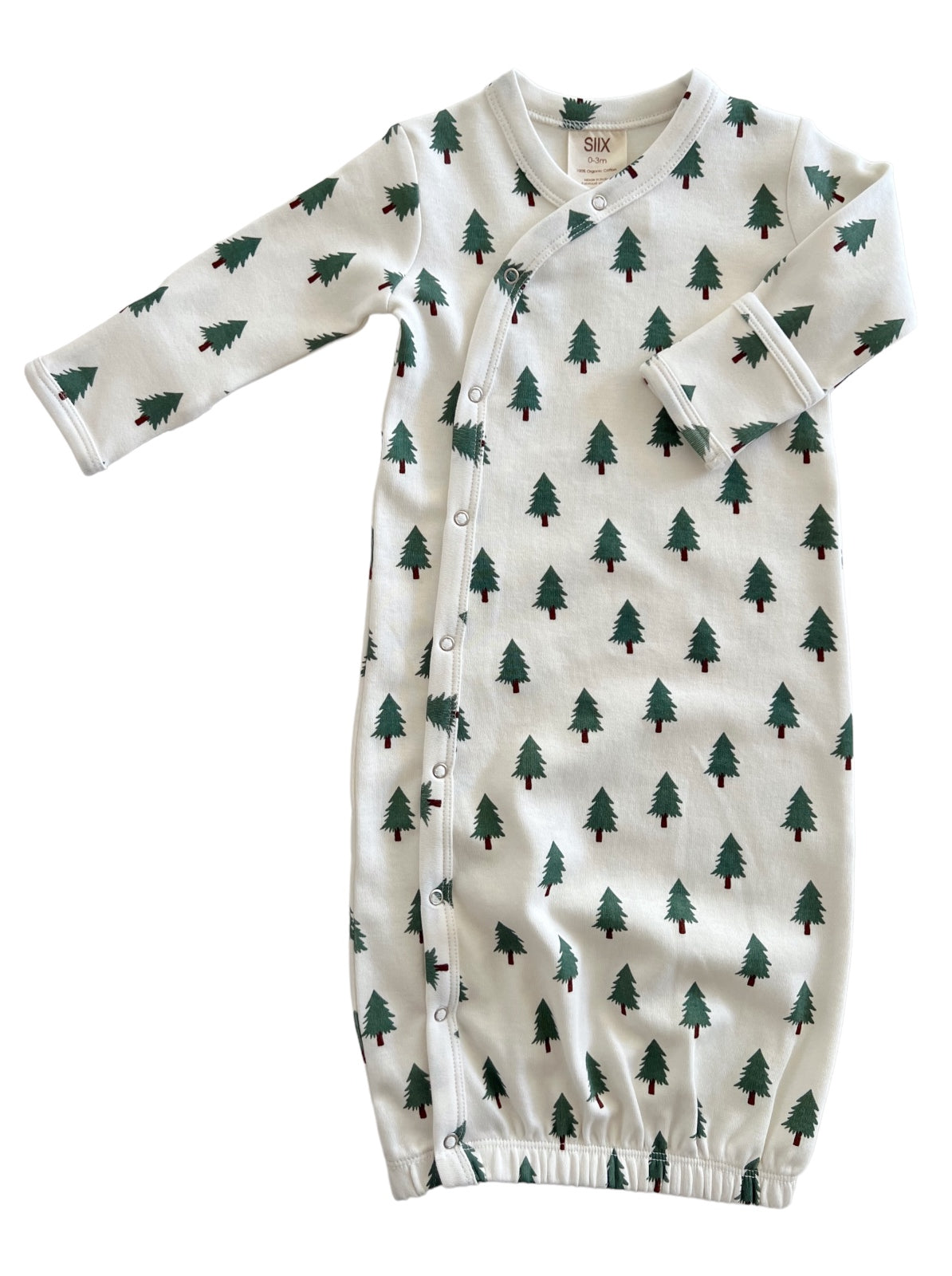 Infant sleep gown with a white background, featuring green tree patterns and snap closures along the side.