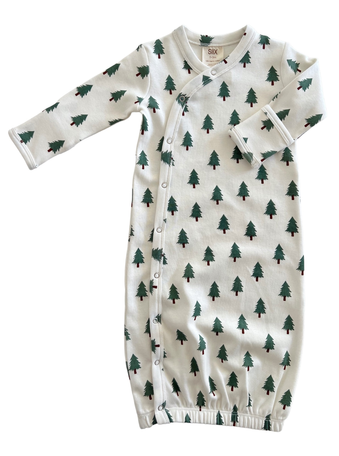 Infant sleep gown with a white background, featuring green tree patterns and snap closures along the side.