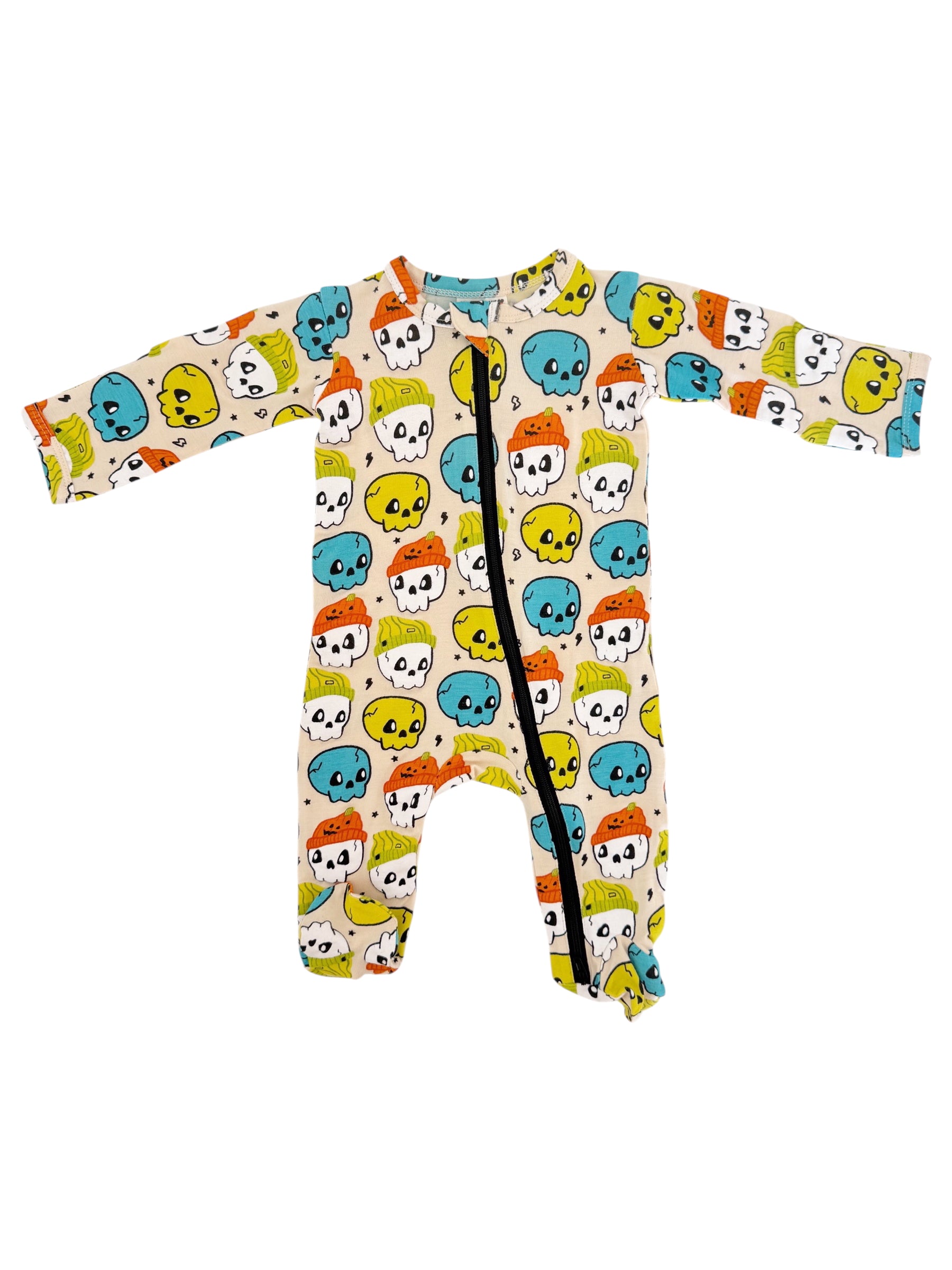 Colorful baby onesie featuring playful skull and candy patterns on a light background.