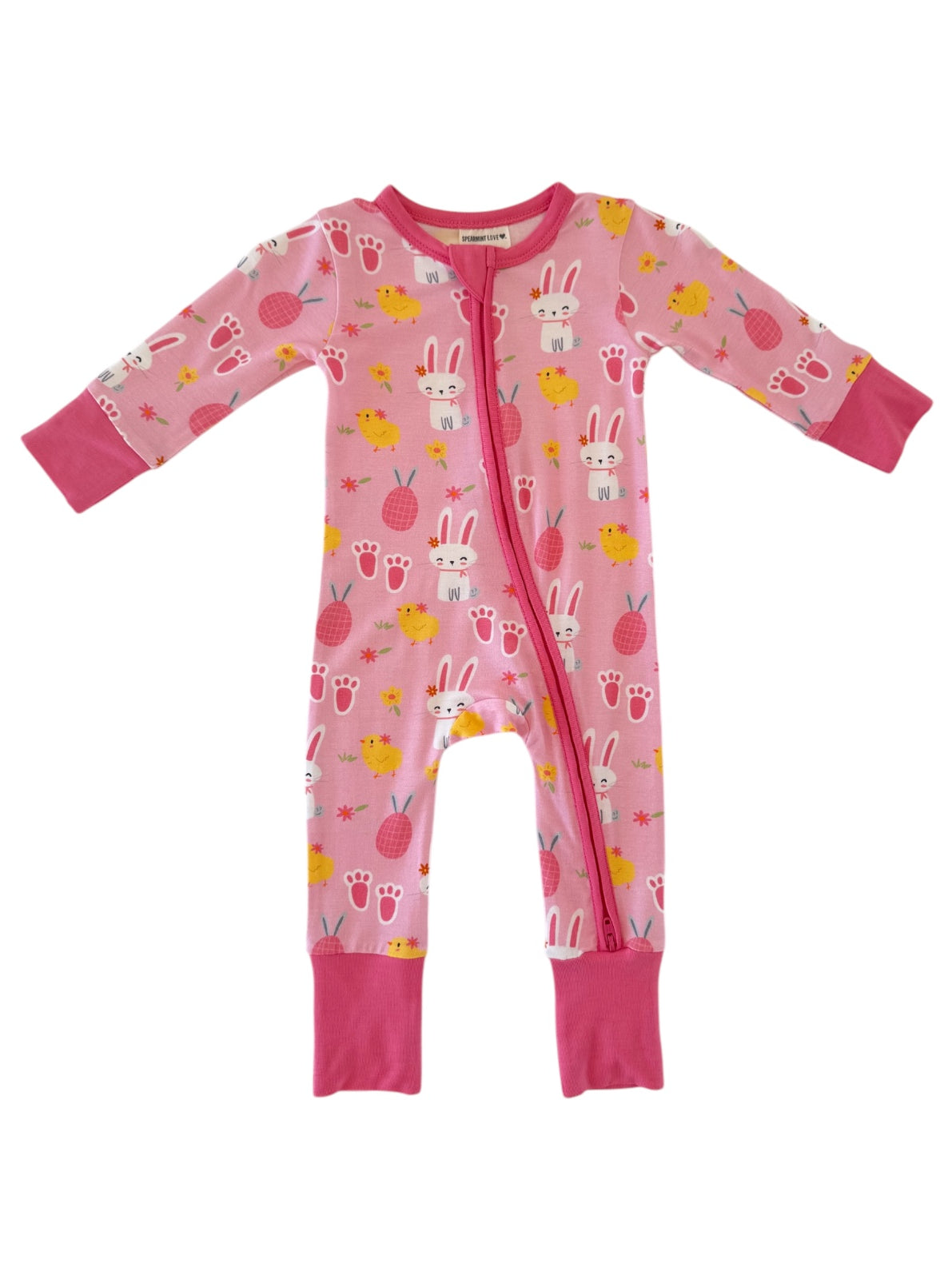 Pink baby onesie with bunny and chick patterns, featuring long sleeves and zip closure. Perfect for cozy wear.