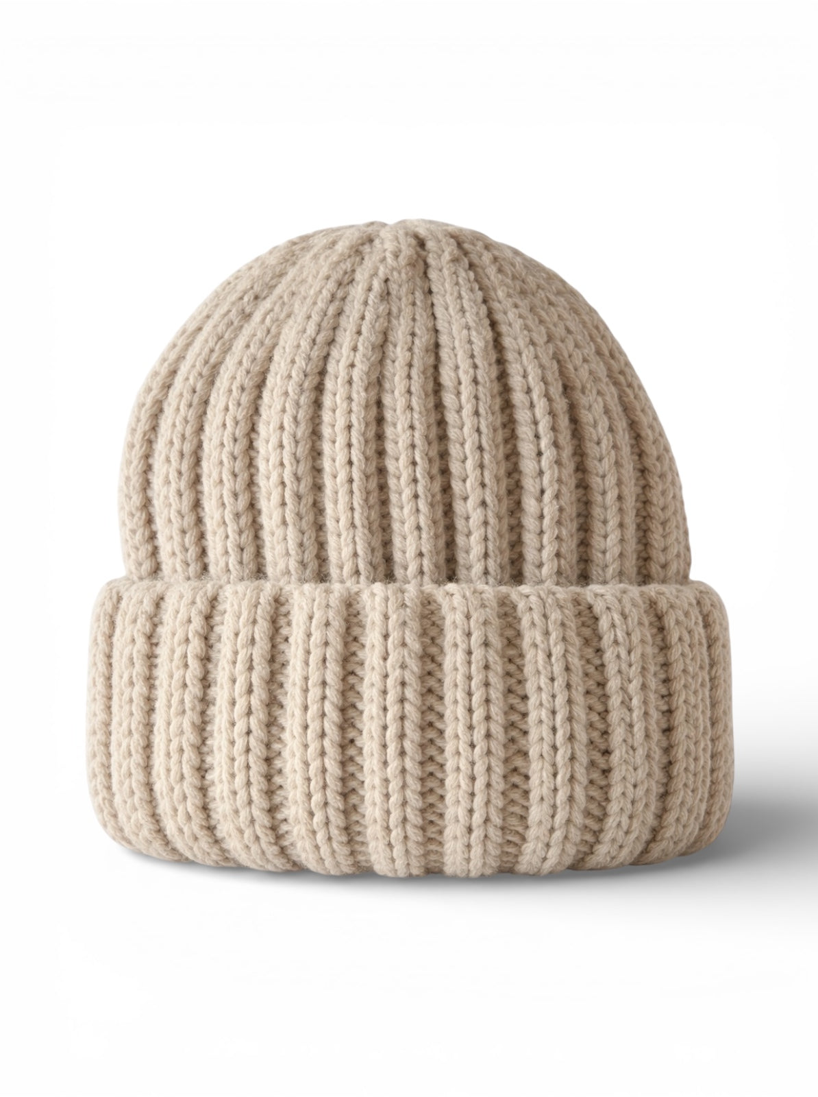 Light beige knit beanie with ribbed texture and folded cuff. Ideal for cold weather wear.