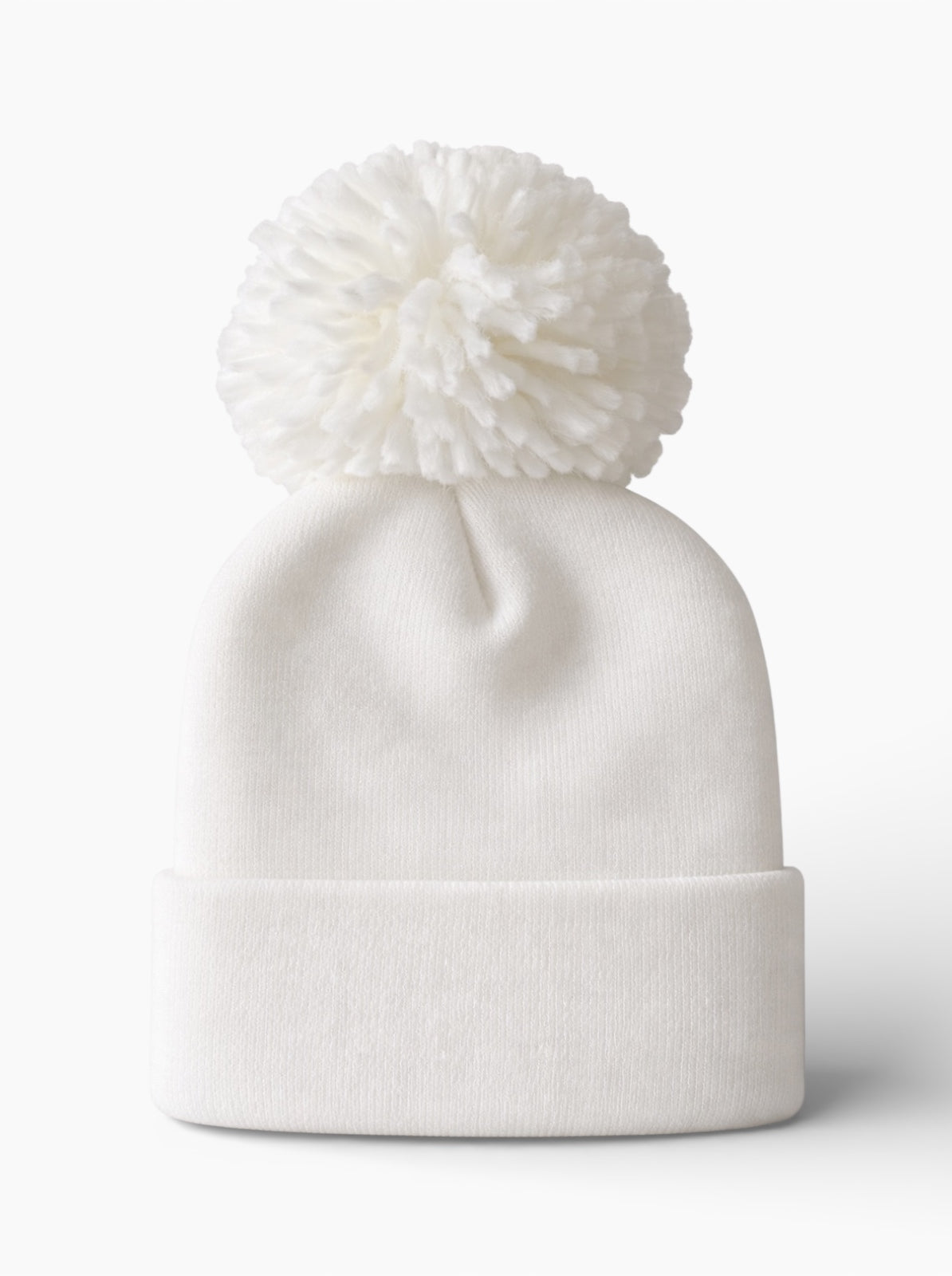 White knitted beanie hat with a large pom-pom on top, perfect for winter wear.