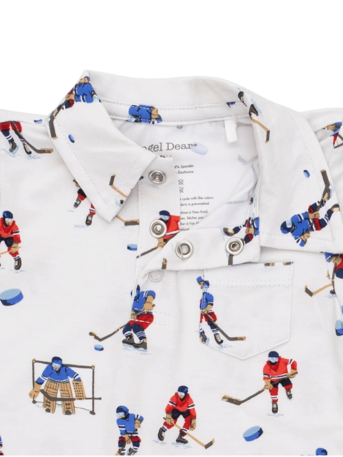 White polo shirt with hockey player illustrations and a collar, featuring buttons and a small chest pocket.