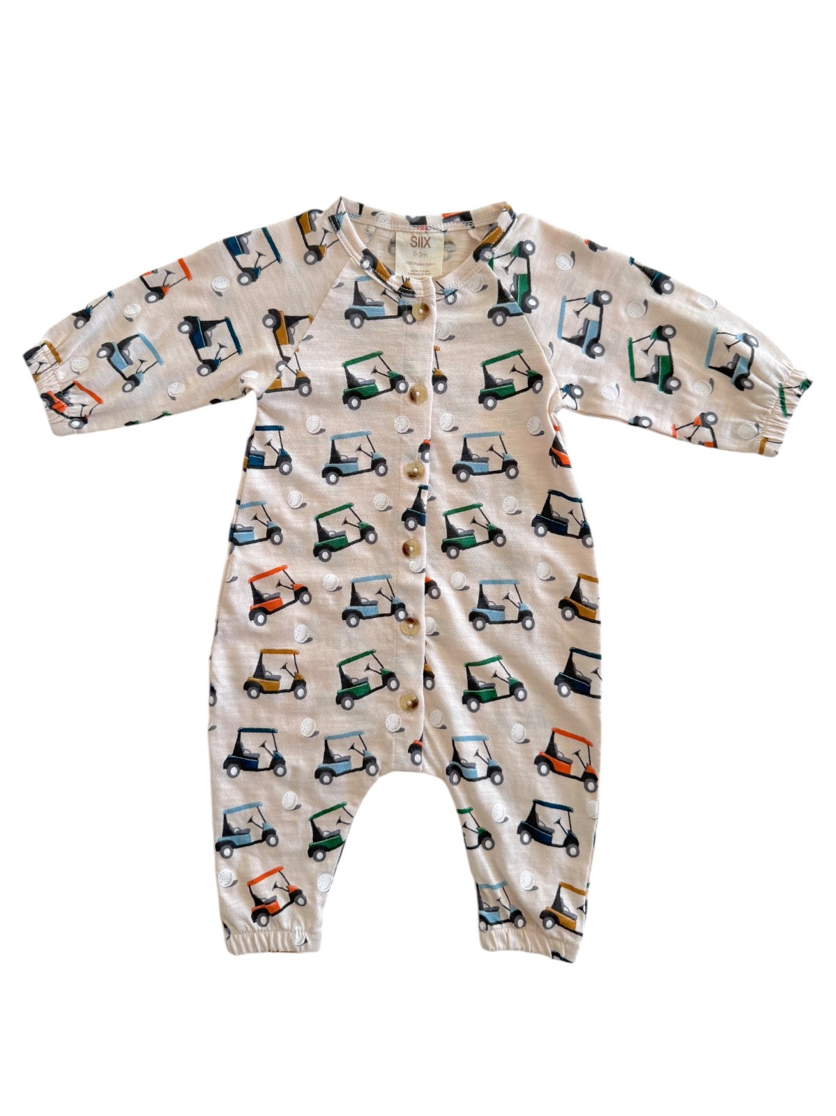 Beige onesie featuring colorful golf cart patterns and button closure, perfect for toddlers.