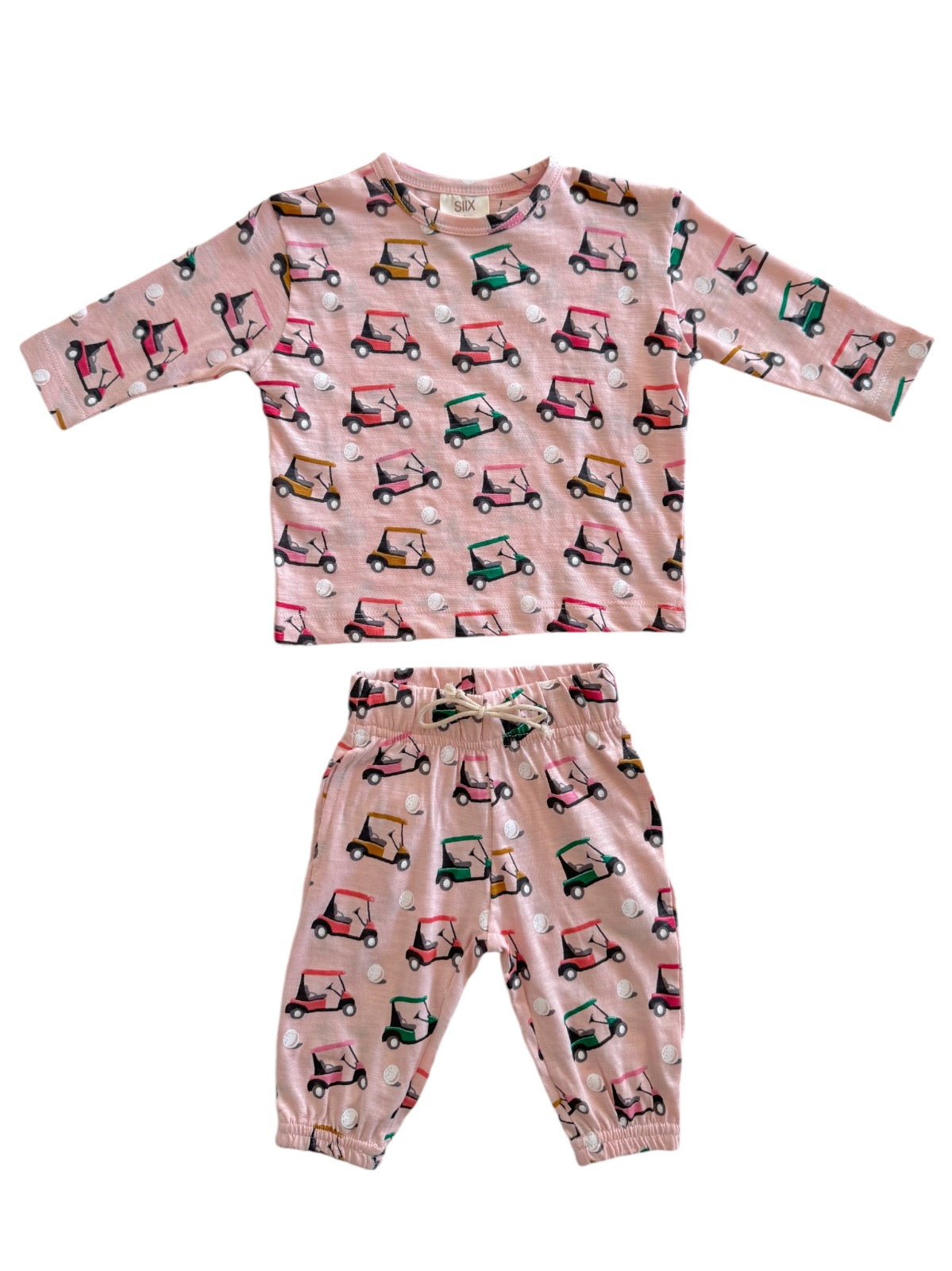 Pink kids' pajama set featuring golf cart patterns on a long-sleeve top and pants.