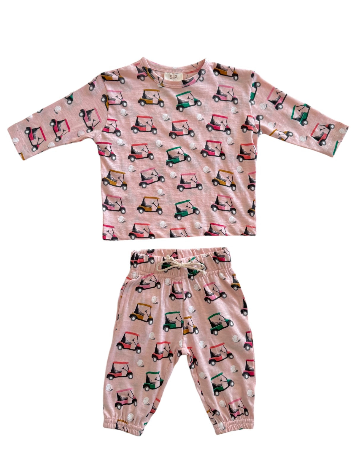 Pink kids' pajama set featuring golf cart patterns on a long-sleeve top and pants.