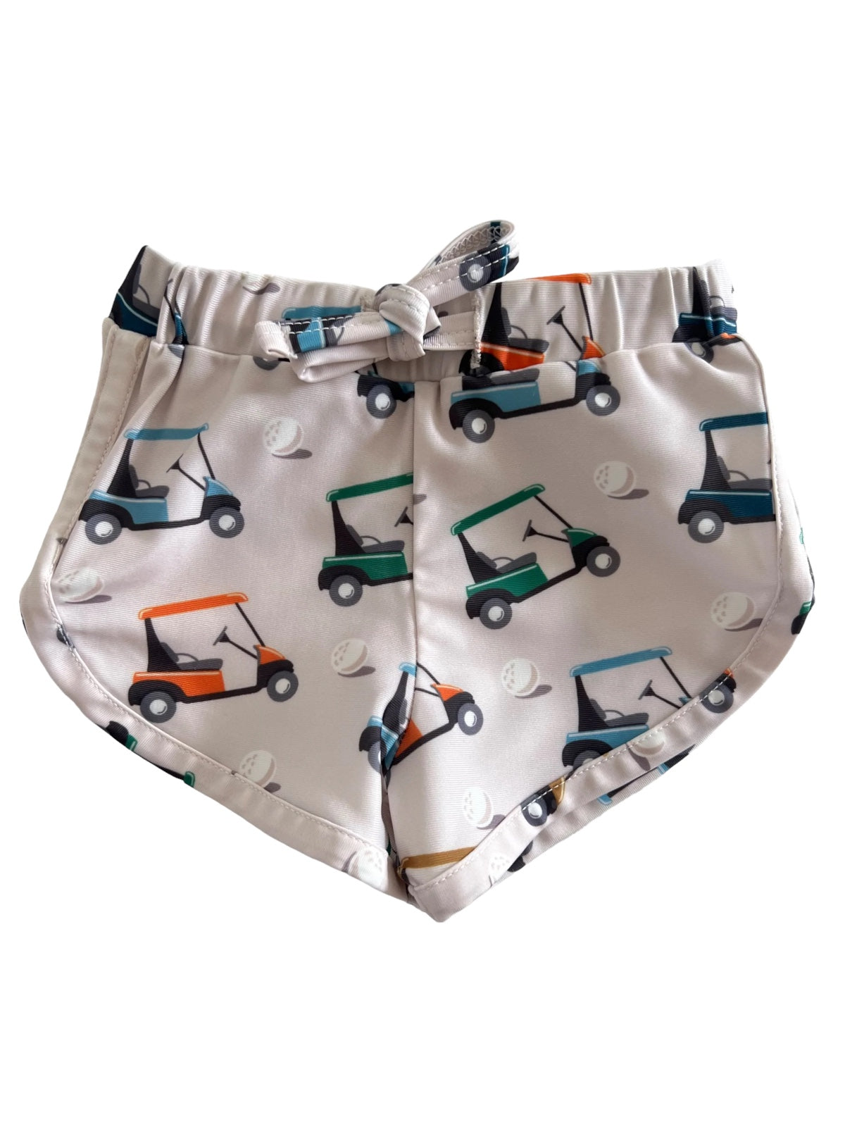 Golf cart patterned shorts with a drawstring, featuring multiple golf carts and golf balls on a light background.