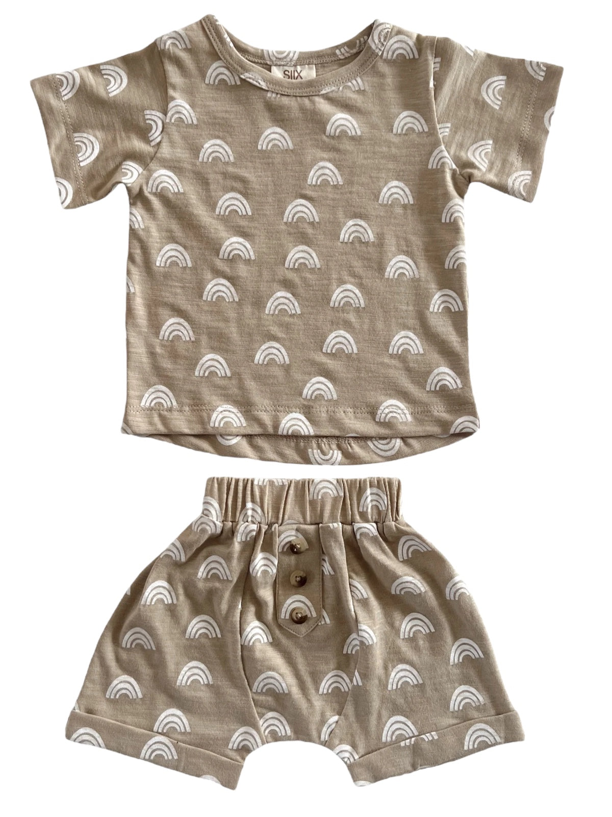 Beige children's outfit featuring white rainbow patterns, including a short-sleeve top and matching shorts.