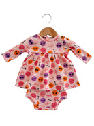 Pink toddler dress with skull and crossbones pattern, featuring long sleeves and matching bottoms.