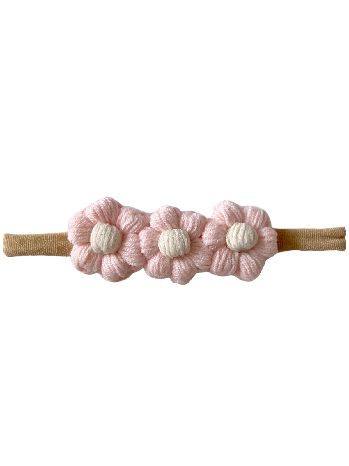 Pink flower hairband with three fabric flowers and a tan elastic strap. Ideal for children’s hair accessories.