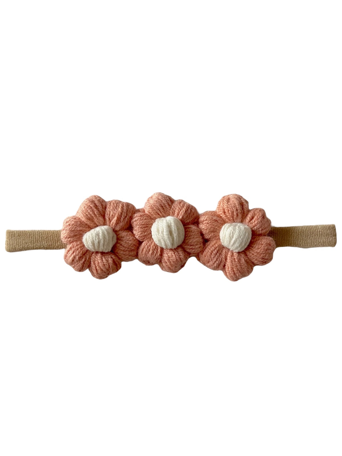 Pink flower hair band with three textured flowers and a beige elastic strap. Ideal for kids' accessories.