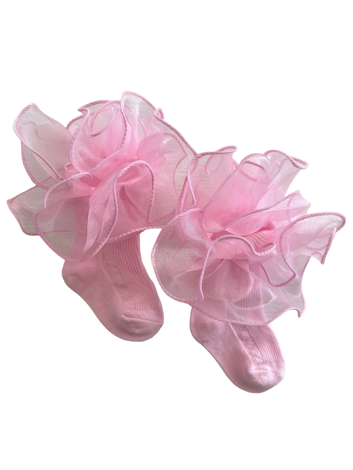 Pink socks adorned with fluffy tulle ruffles, perfect for adding a whimsical touch to children's outfits.