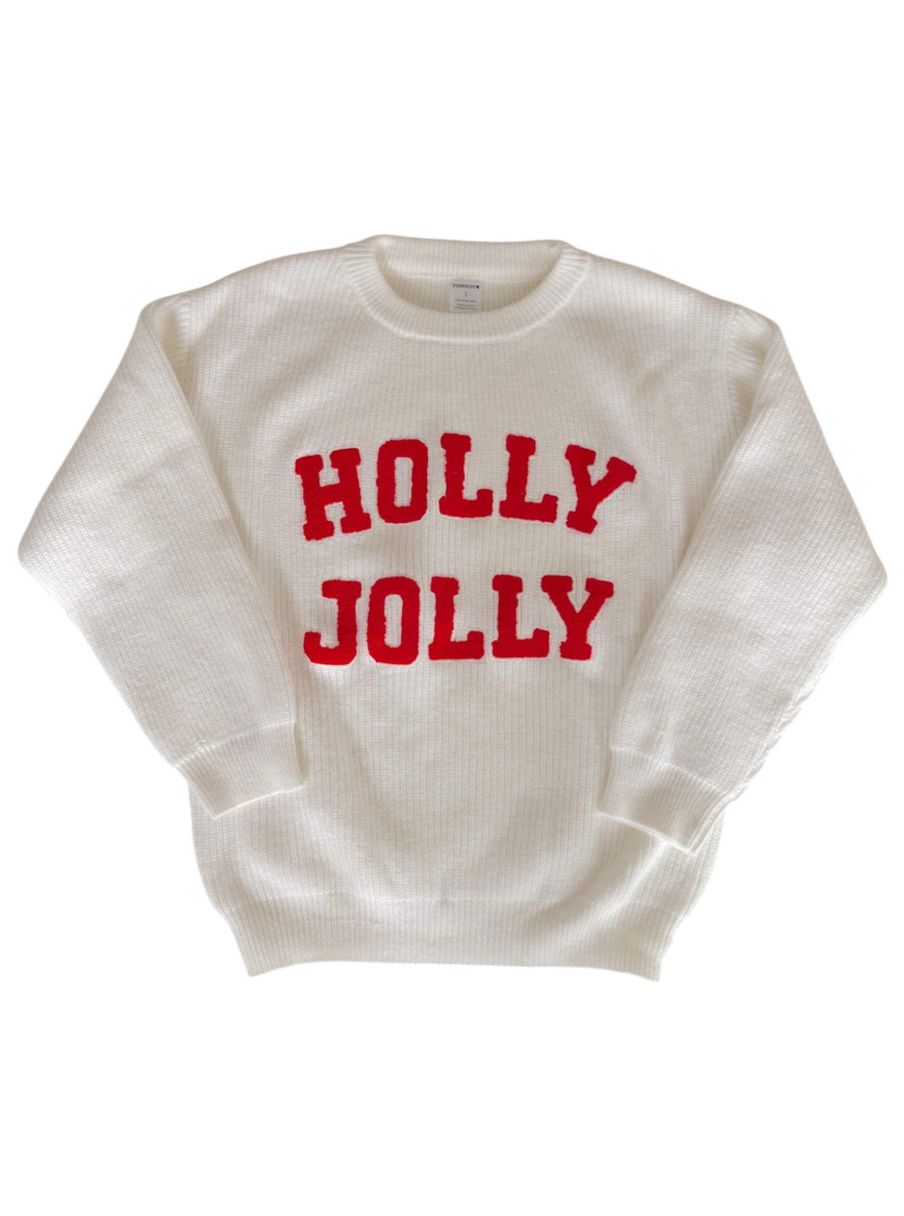 White sweater with "HOLLY JOLLY" in bold red letters across the front.