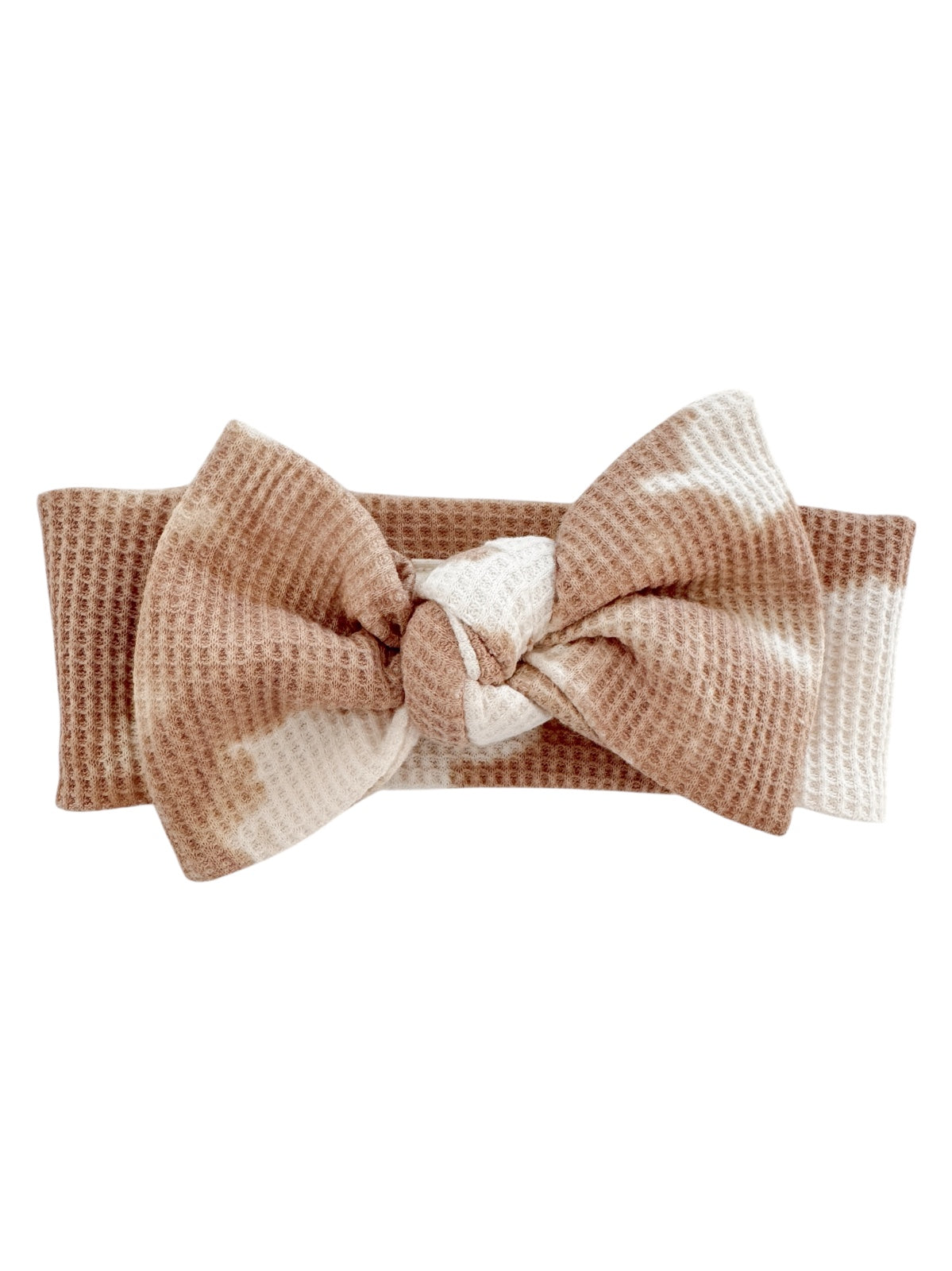 Brown and white patterned headband with a large bow design, made of soft textured fabric.