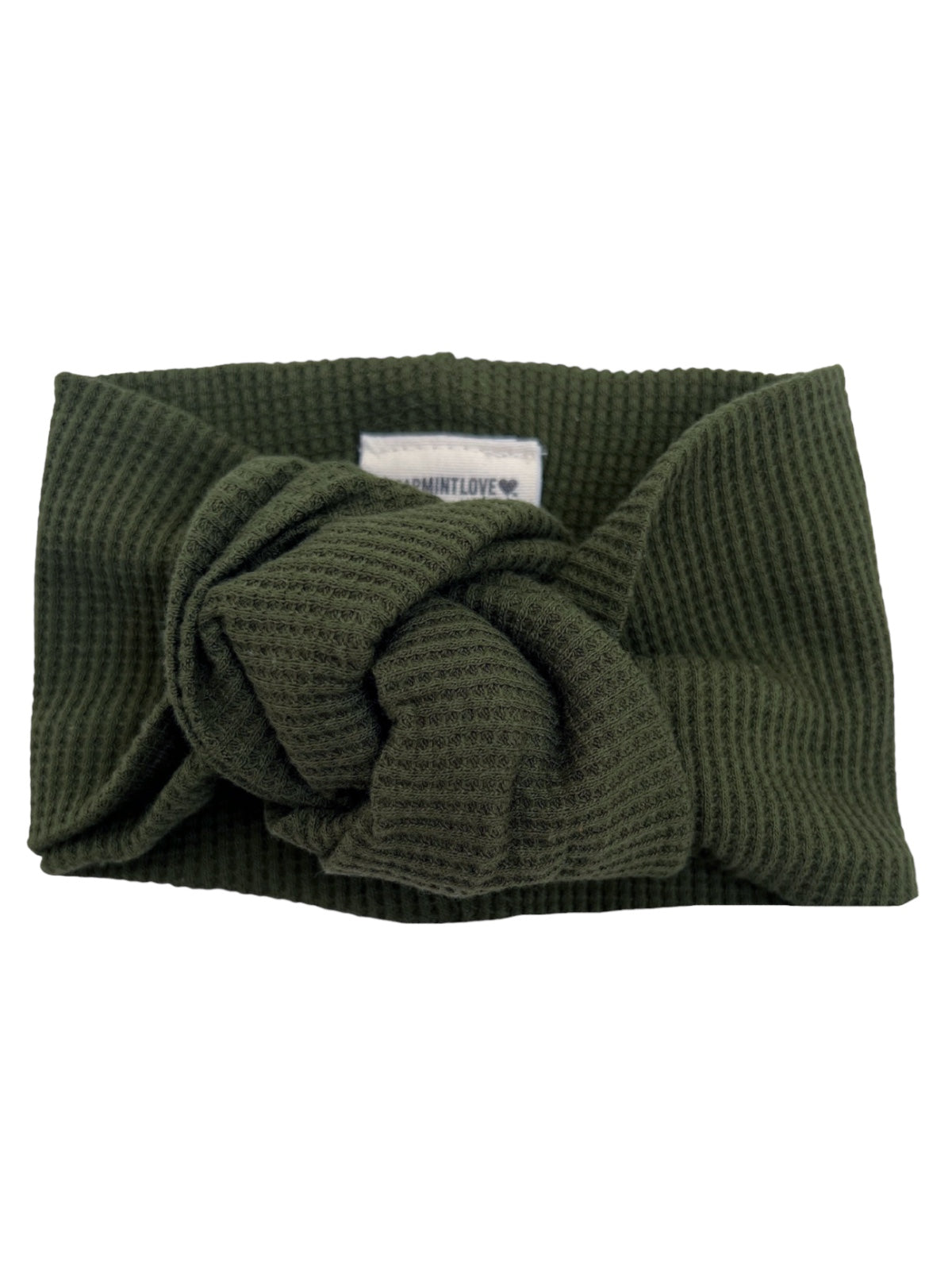 Green textured headband with a knot detail at the front, featuring a small logo tag inside.