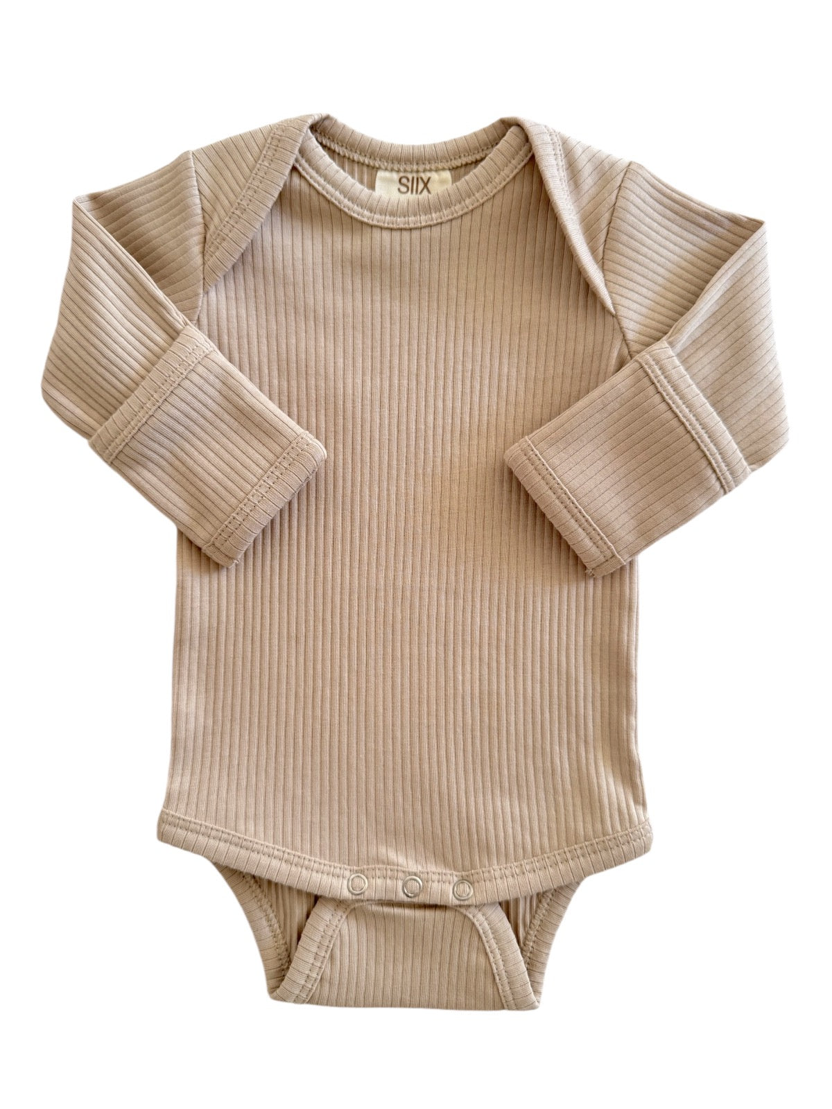 Beige ribbed long-sleeve baby bodysuit with snap buttons at the bottom and soft fabric for comfort.