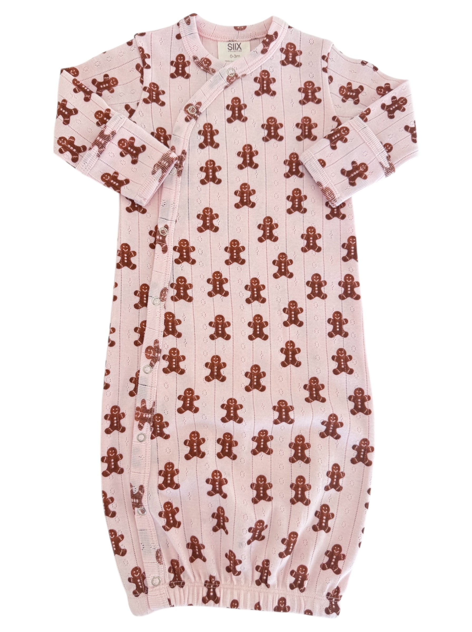 Pink baby gown with brown gingerbread man patterns, featuring snap buttons and long sleeves.
