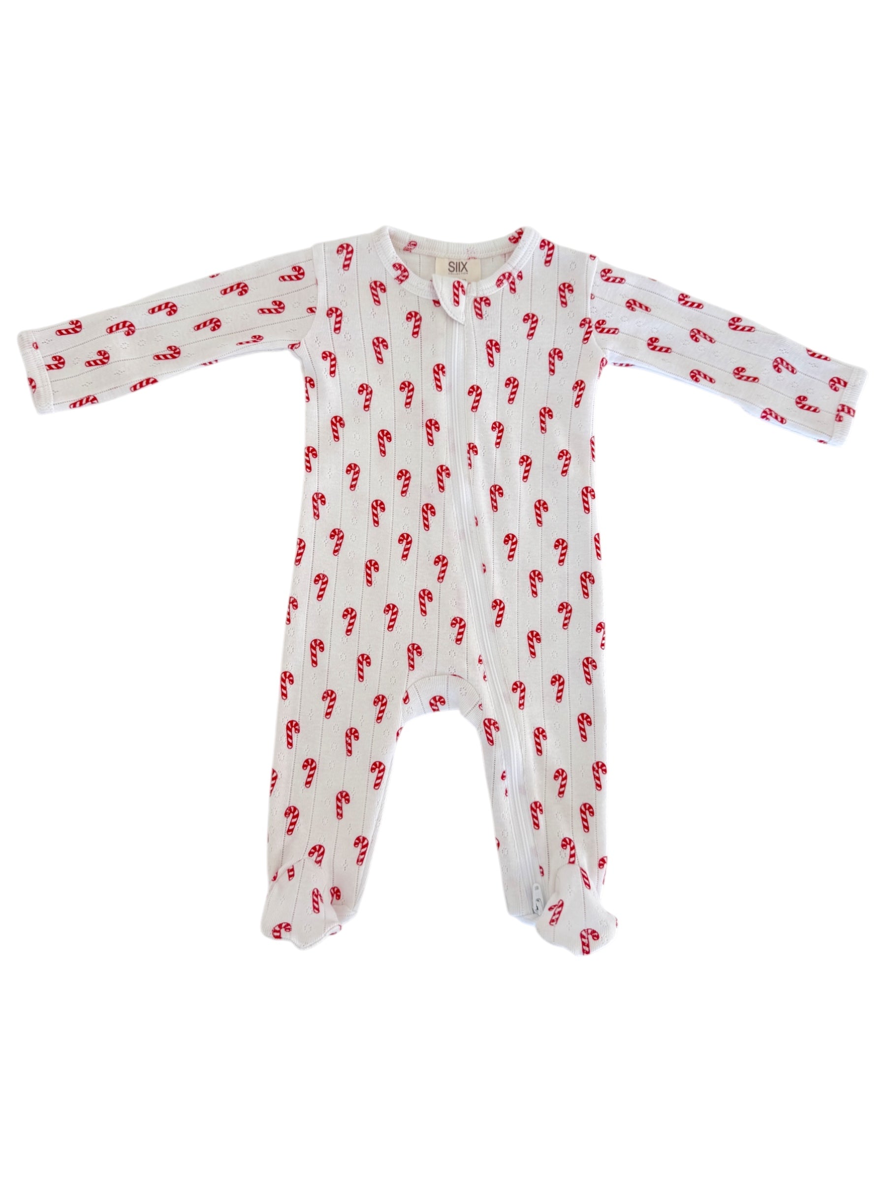White baby onesie with red candy cane print, featuring long sleeves and full-length legs.