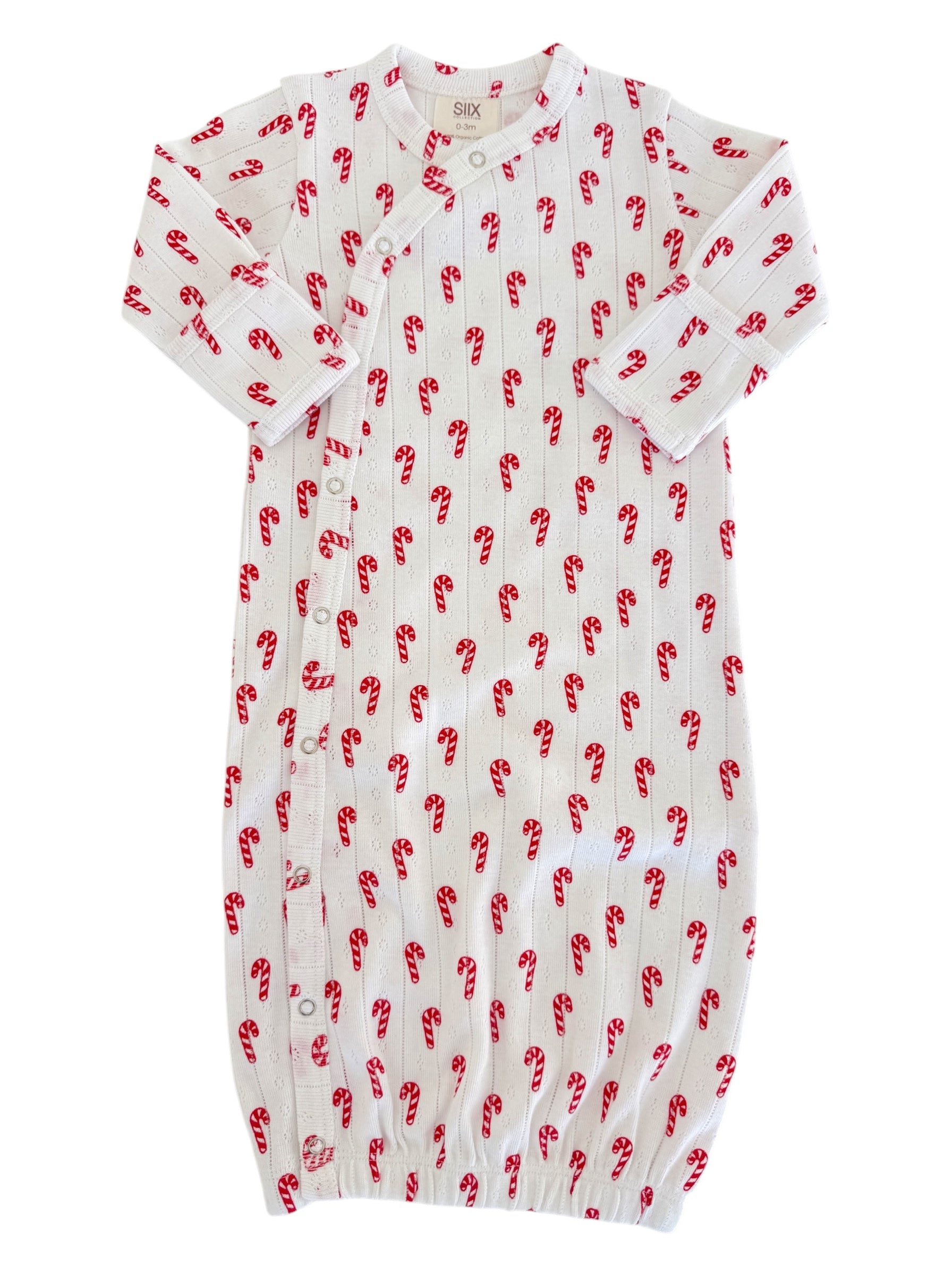White baby gown with red candy cane print and snap buttons, suitable for newborns up to 3 months.