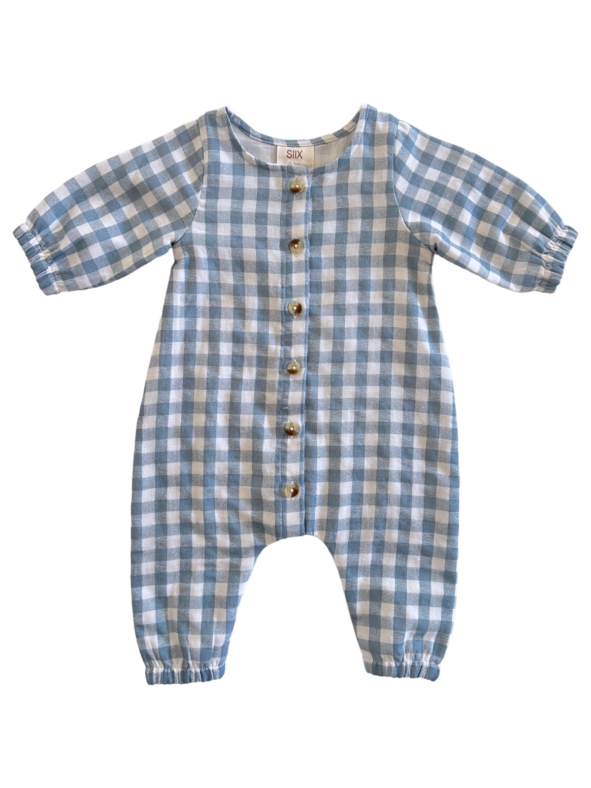 Light blue and white checkered baby romper with button closure and puffed sleeves. Ideal for infants and toddlers.