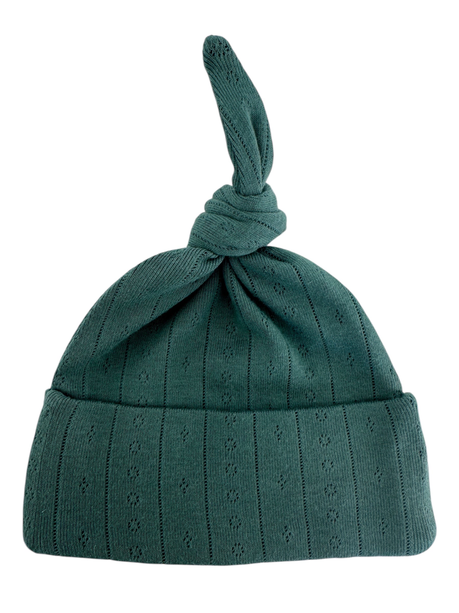 Green knitted hat with a knotted top and a textured pattern, suitable for casual wear.