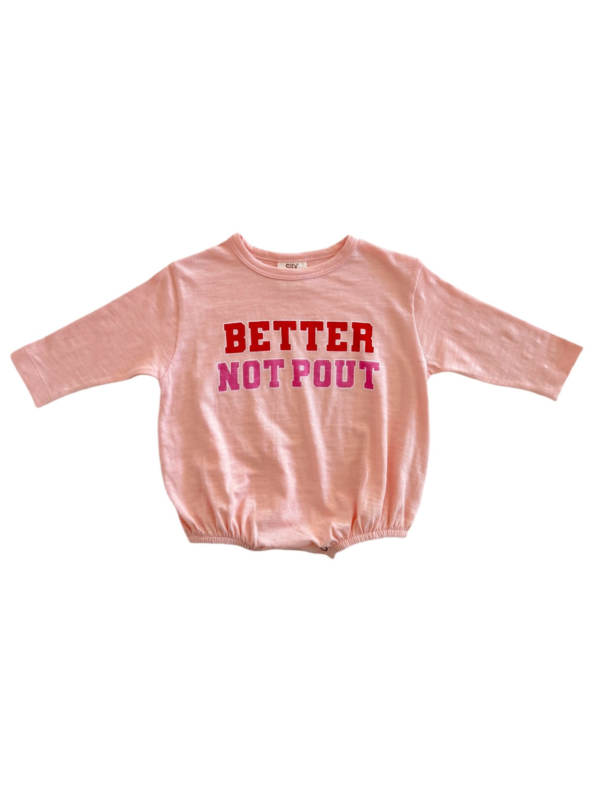 Pink long-sleeve shirt with the text "BETTER NOT POUT" in red and pink letters across the front.