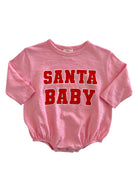 Pink baby bodysuit with "SANTA BABY" printed in bold red letters.