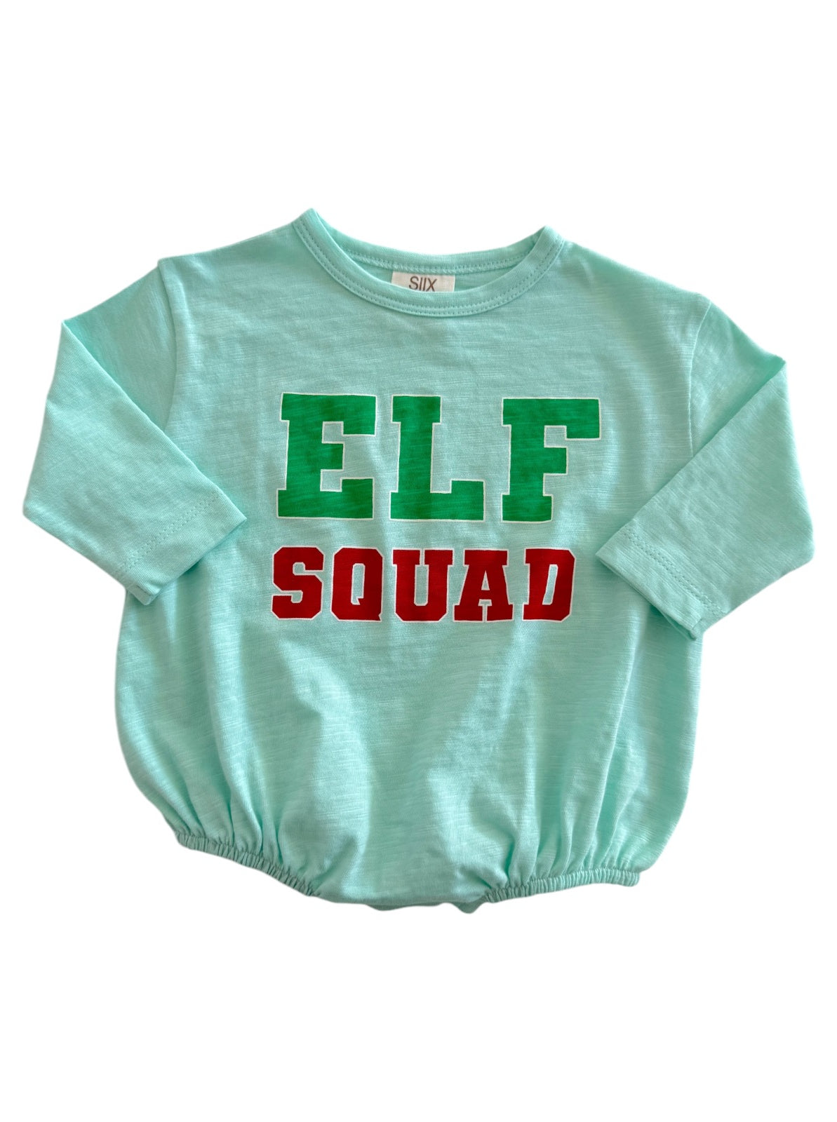Light blue shirt with "ELF SQUAD" printed in green and red letters. Suitable for festive occasions.