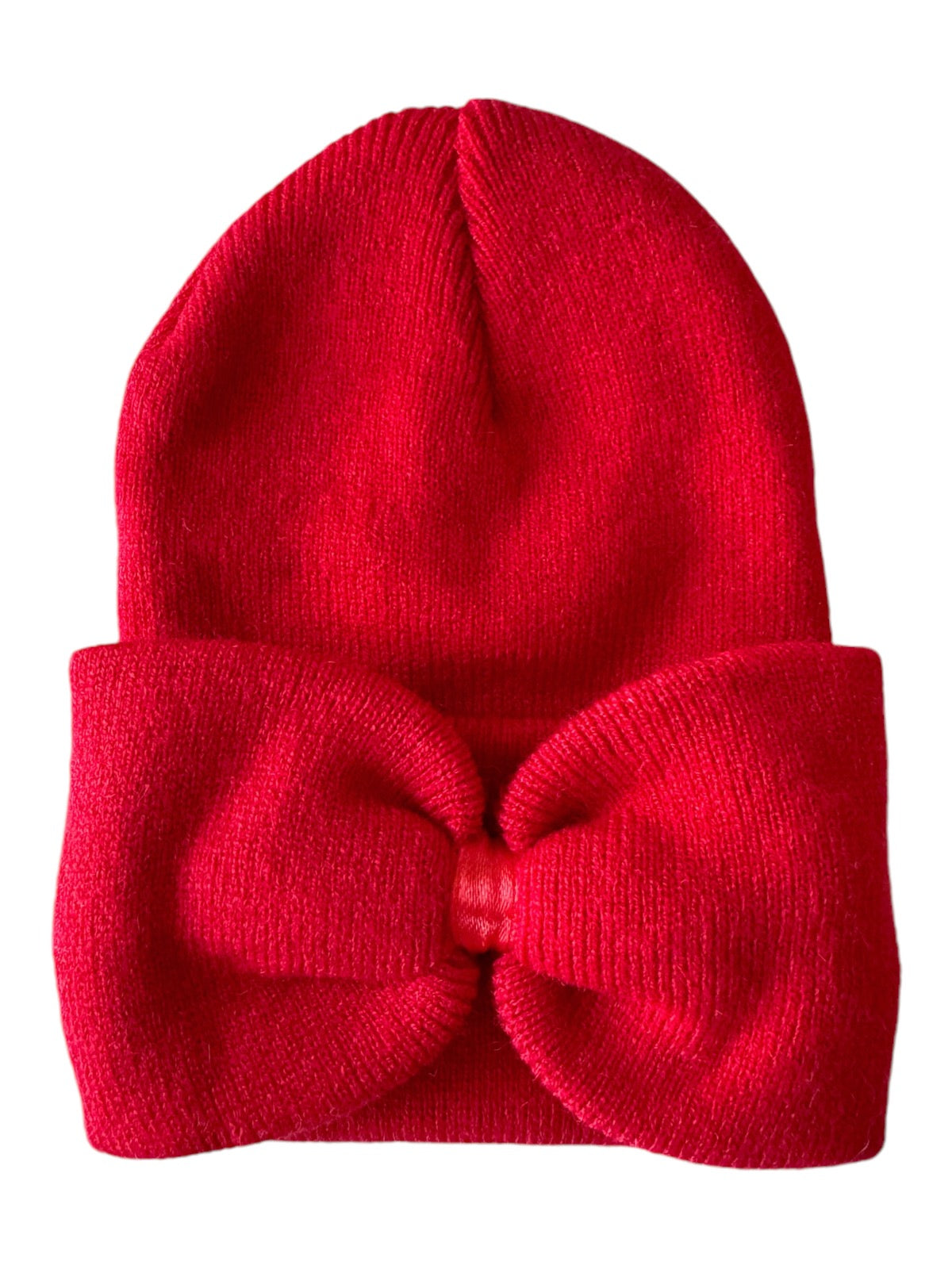 Red knitted beanie hat with a large bow detail on the front.