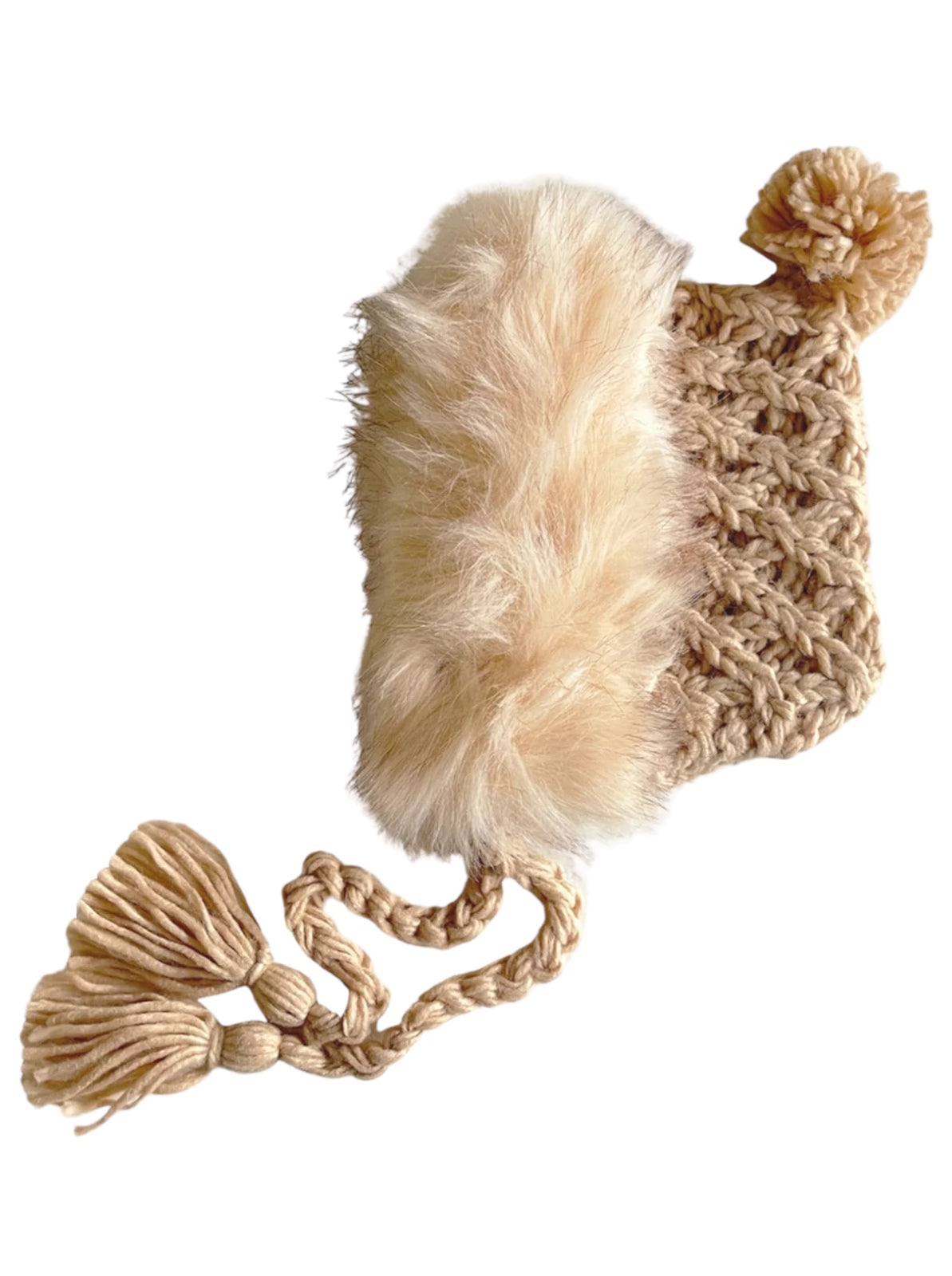 Light beige knitted hat with faux fur trim and pom-pom, featuring braided tassels at the ends.