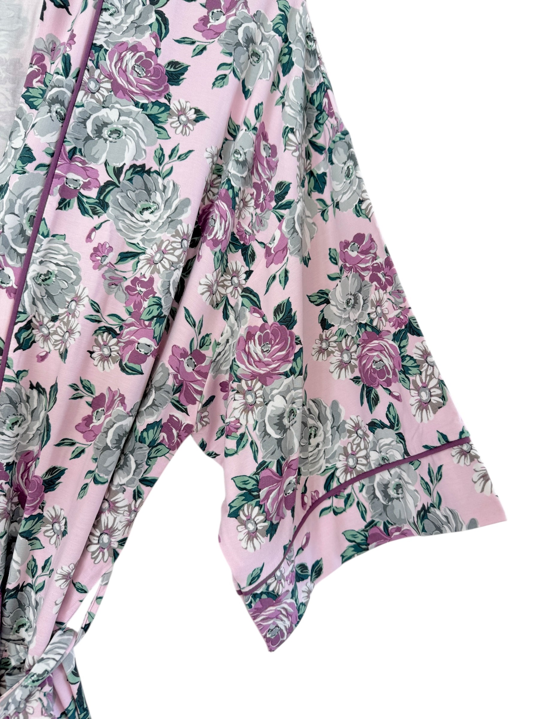 Floral pink robe featuring large gray and purple roses, with a relaxed sleeve design.