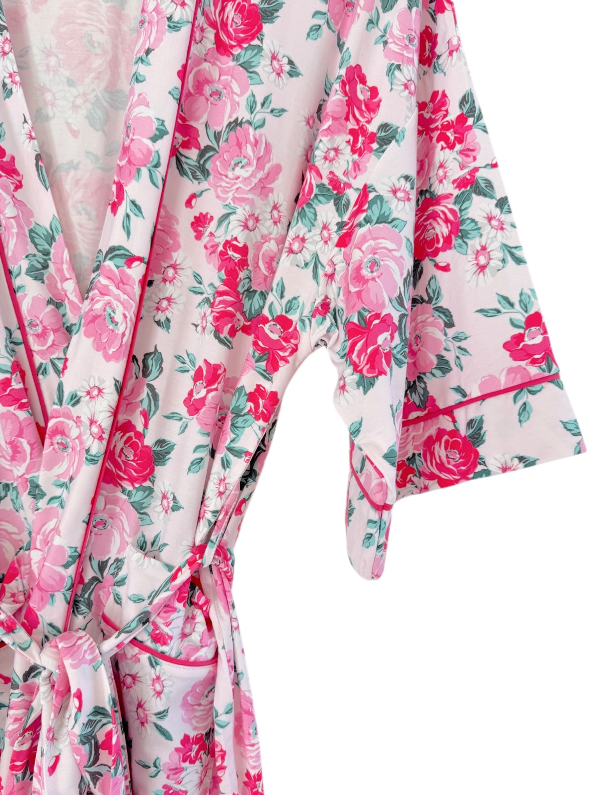 Floral-patterned robe in pink and green, with a tie belt and short sleeves. Perfect for casual wear or lounging.