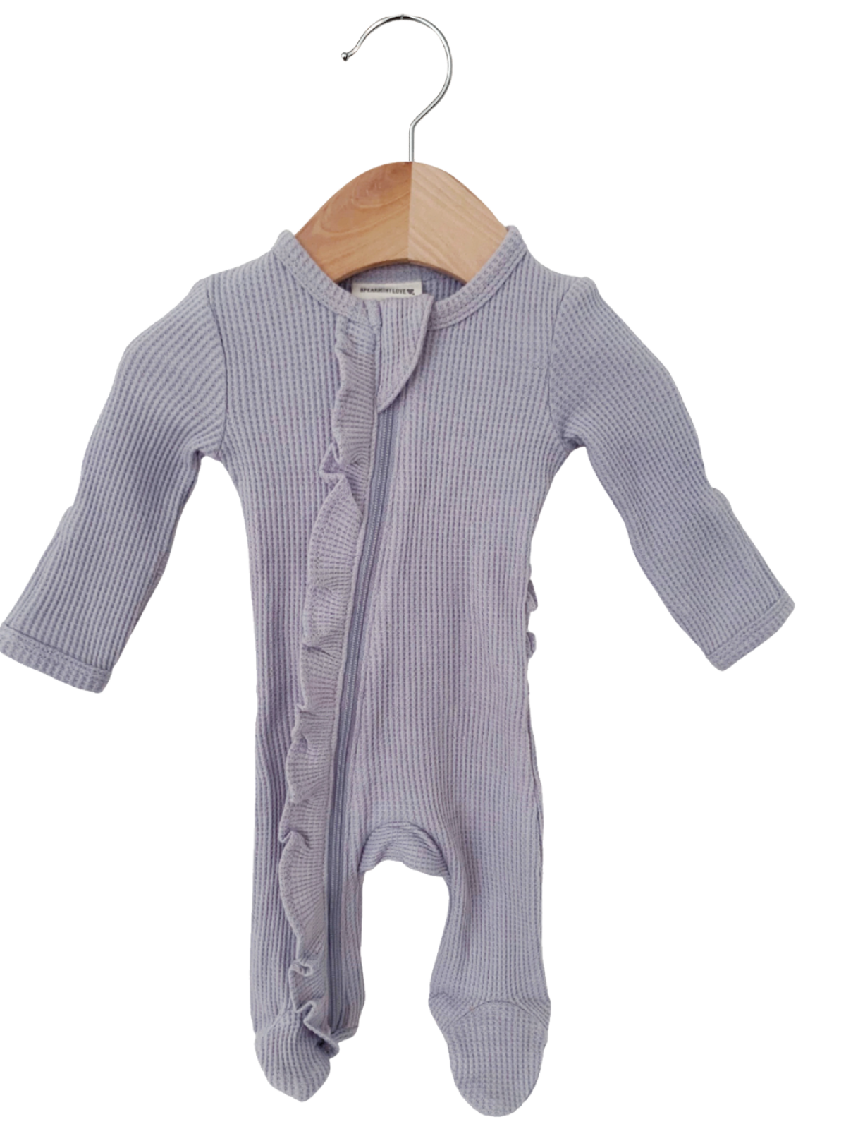 Light purple baby onesie with ruffle detail, displayed on a wooden hanger against a white background.