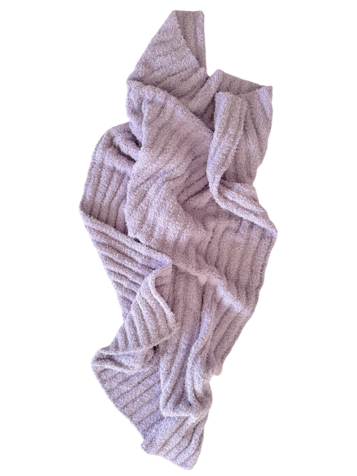 Light purple, textured blanket draped casually, featuring wavy ribbed patterns.
