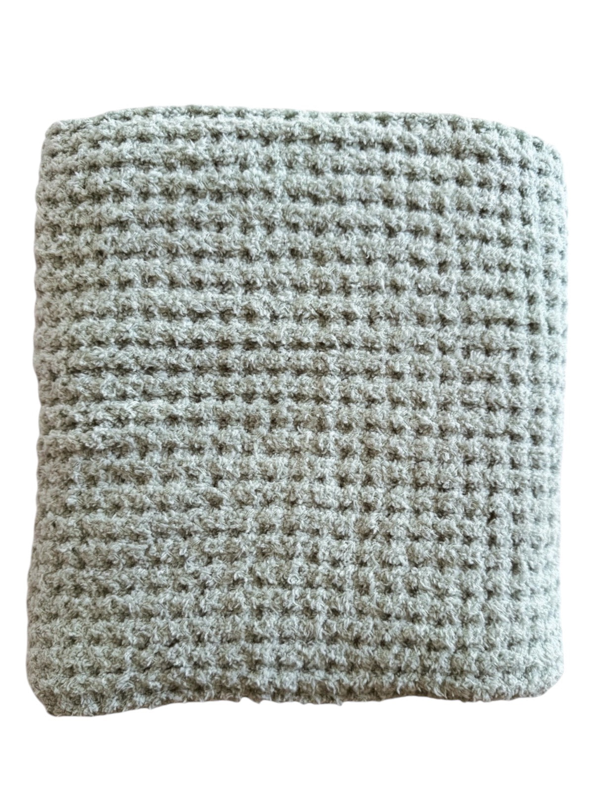 Textured gray blanket folded neatly, showcasing a soft, woven pattern for cozy warmth and comfort.