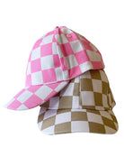 Two checkered baseball caps, one pink and white, the other brown and white, stacked together.