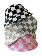 Stack of checkered bucket hats in black, white, gray, beige, and pink arranged artistically.