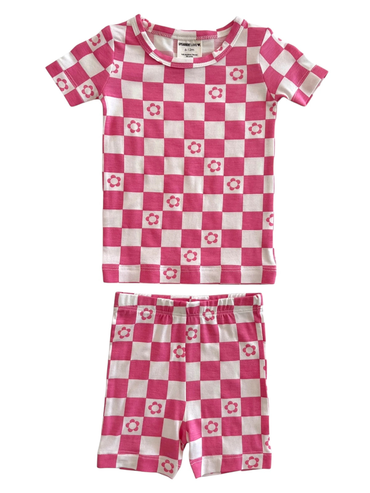 Pink checkered sleepwear set featuring a short-sleeve top and shorts with flower designs.