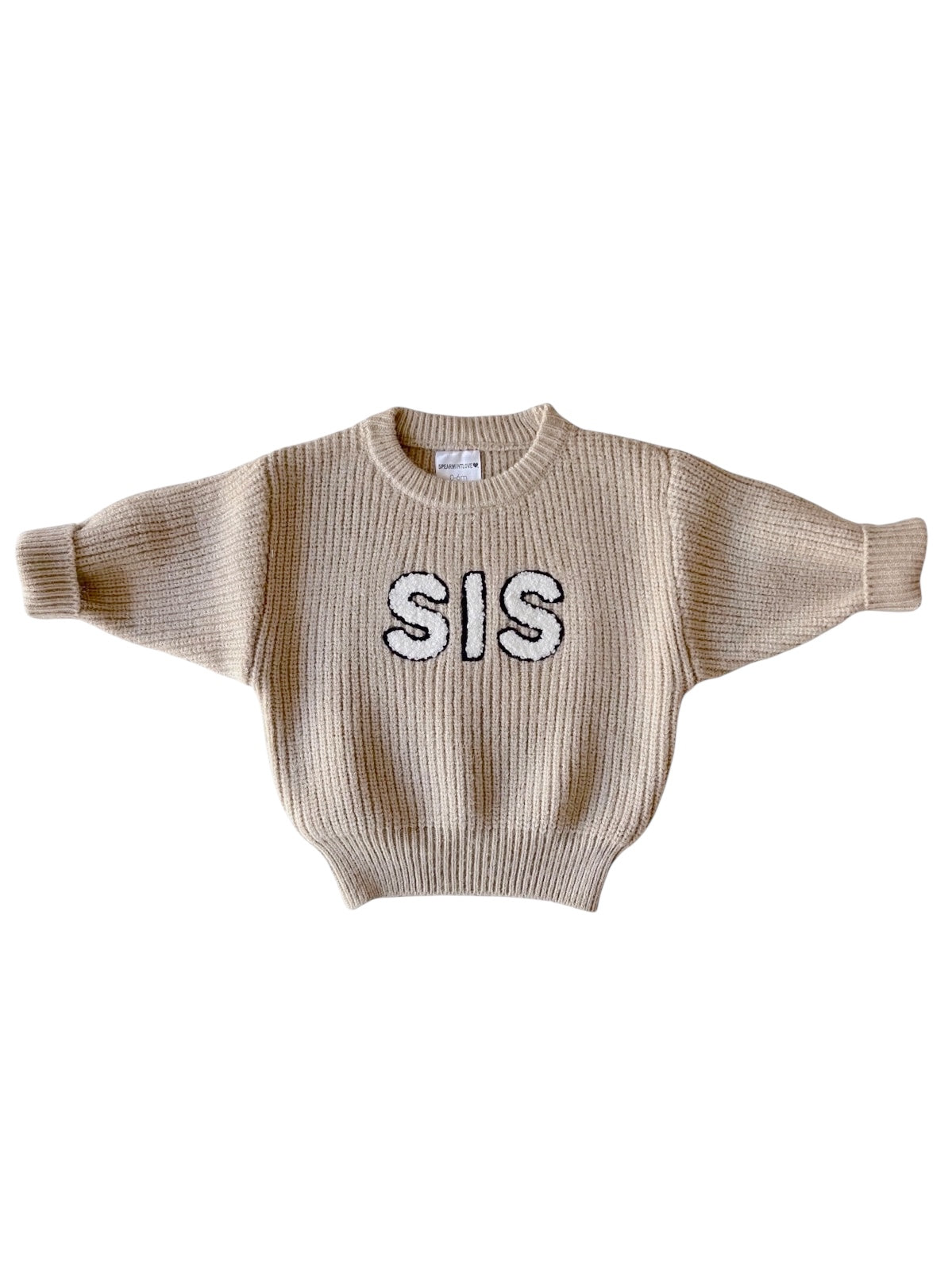 Beige sweater with wide sleeves featuring the word "SIS" in black on the front.