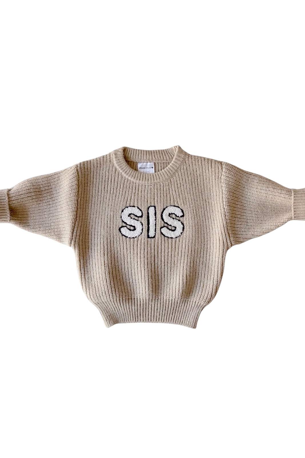 Beige sweater with wide sleeves featuring the word "SIS" in black on the front.