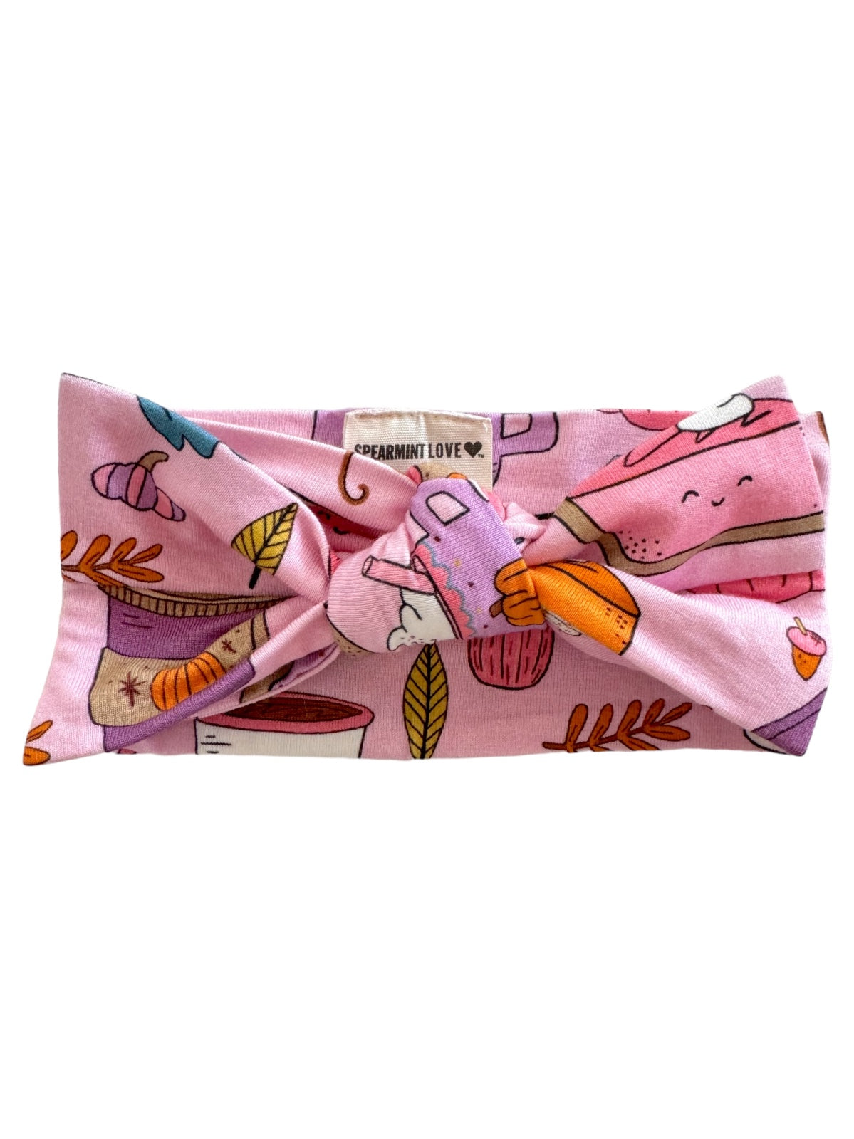Pink patterned headband featuring whimsical designs of food, leaves, and drinks, labeled "SPEARMINT LOVE."