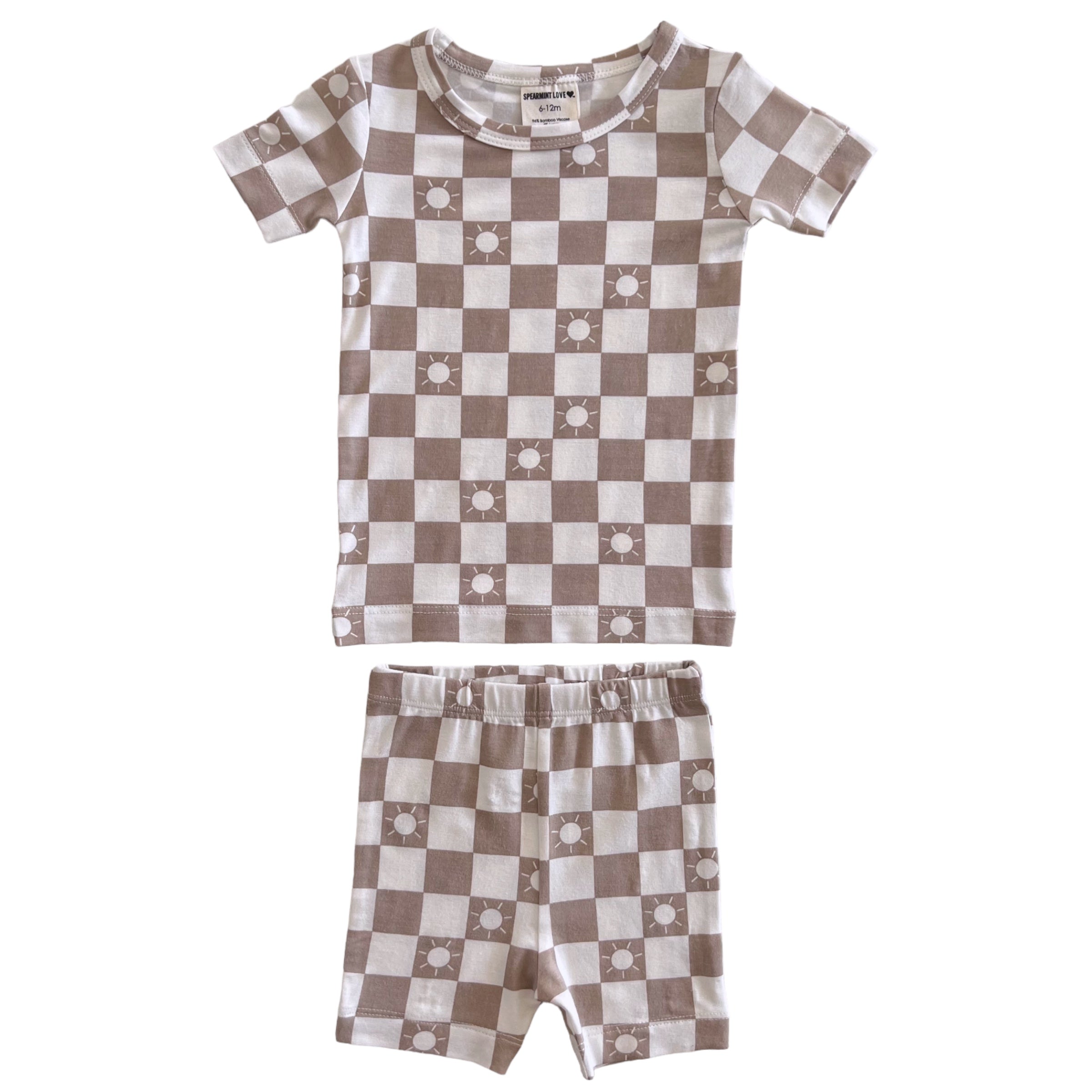Brown checked two-piece pajama set with sun motifs, featuring a short-sleeve top and matching shorts.